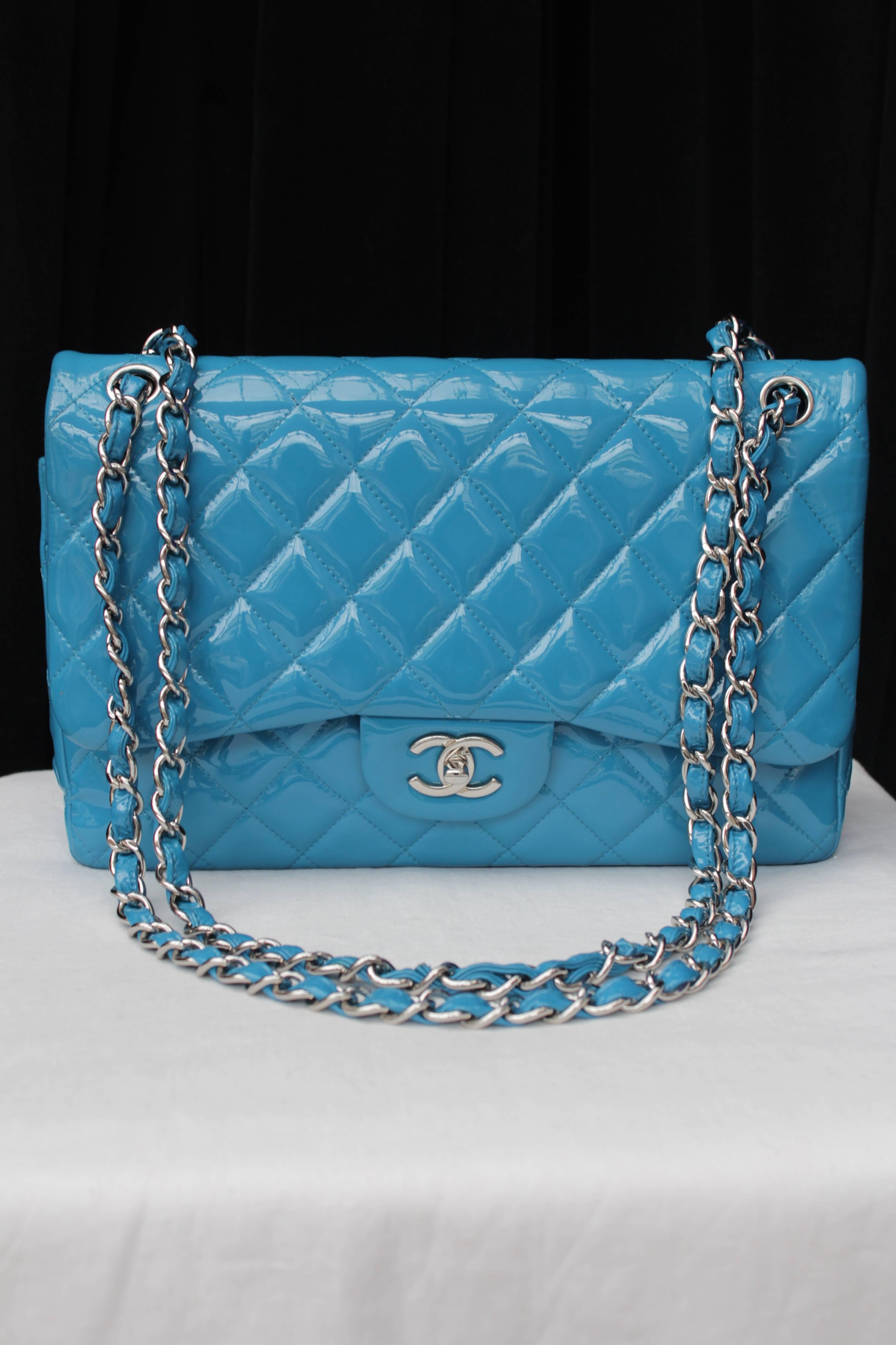 CHANEL (Made in France) Shoulder bag model timeless in a Jumbo size in turquoise patent quilted leather with a double flap closing with a silver metal CC turnlock. The bag also features a sliding double handle in leather interlaced with silver metal
