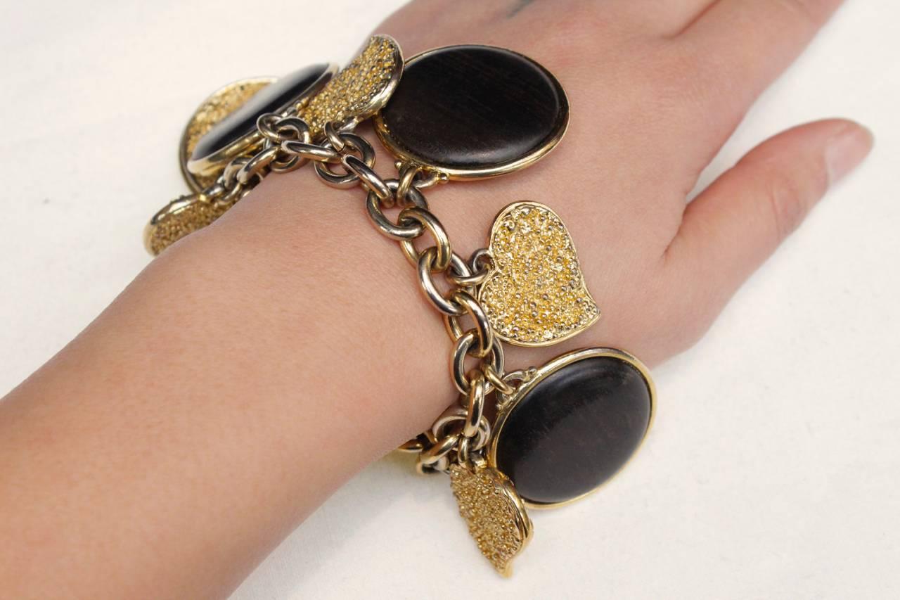 Late 1980s Yves Saint Laurent Wood and Gilt Charms Bracelet In Good Condition In Paris, FR
