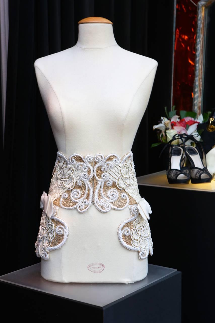 CHRISTIAN DIOR BOUTIQUE Magnificient ornemental belt/waistband consisting of white acrylic threads braided, multiple lame tubular beads, white crystals, and white and gold tone passementerie paved with thin faux pearls in an arabesque pattern.