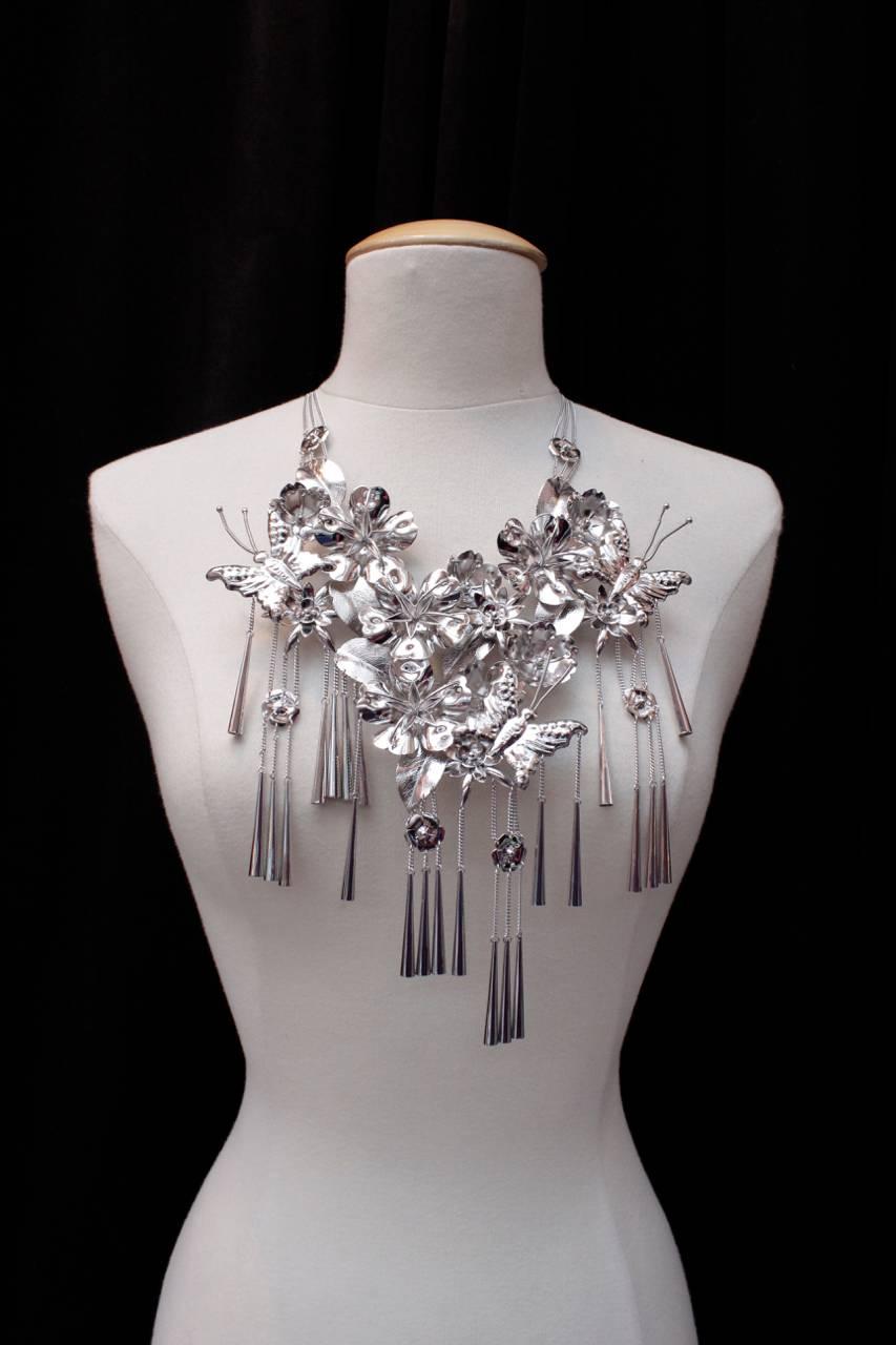 DIOR (Made in France) Extraordinary statement necklace in silver sterling 925 (as shown on the photo) comprising of butterflies, large flowers and leaves, held by two sets of thin silver chains. 

 The butterflies are impressed with DIOR. The