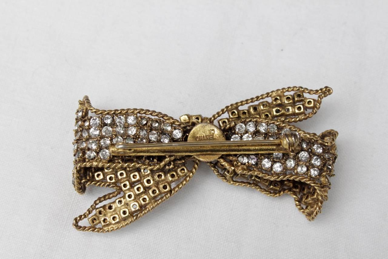 Women's or Men's 1960-1970s Chanel Gilt and Rhinestones Bow Brooch