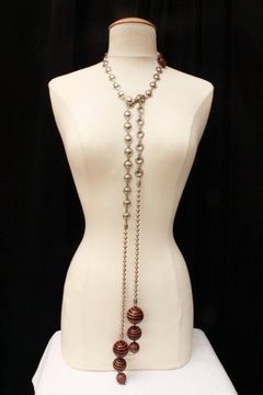 1990s, Jean-Paul Gaultier long tie-necklace with black and orange spheres