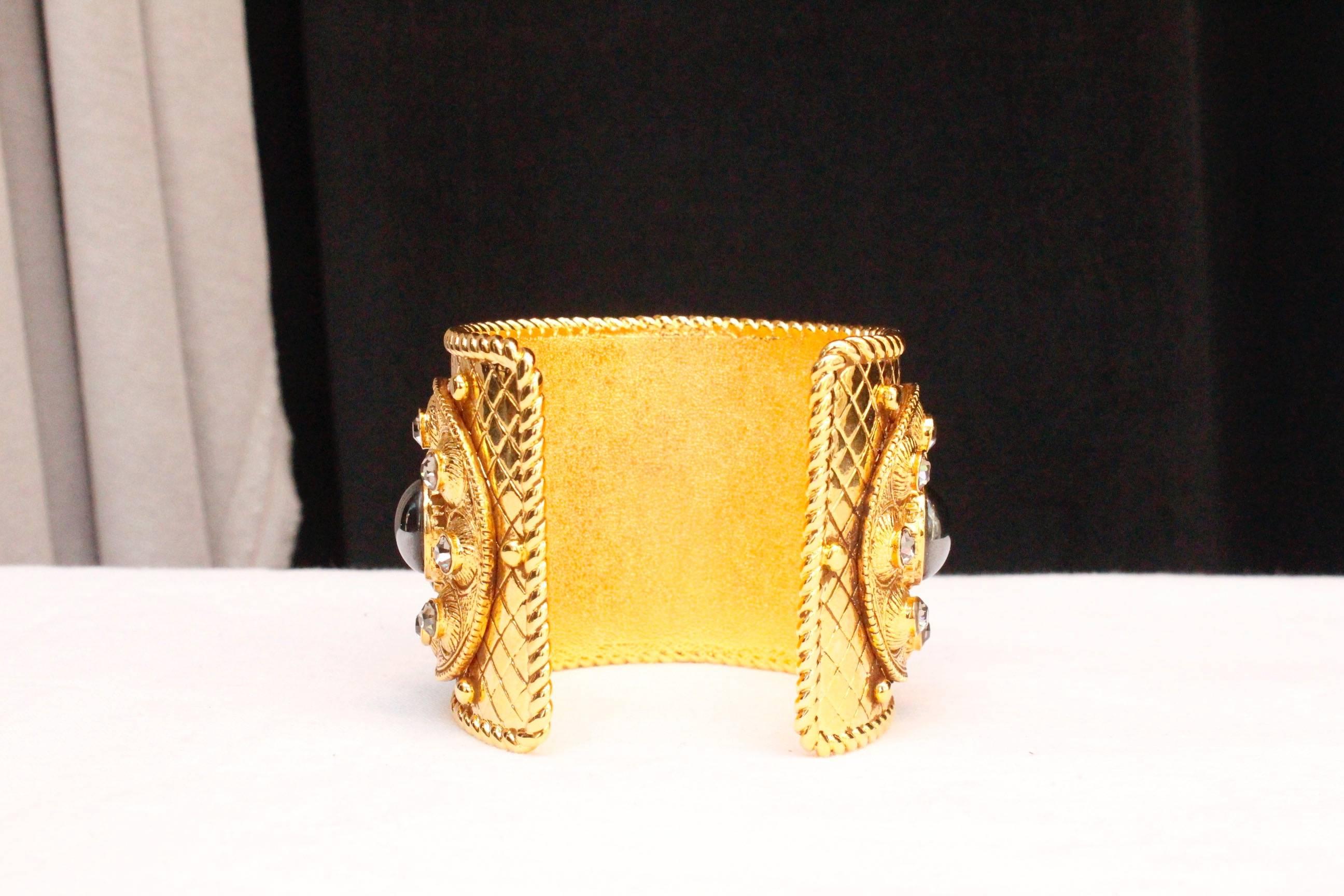 Women's 1990s Christian Dior gilded metal cuff bracelet with rhinestones and cabochons For Sale