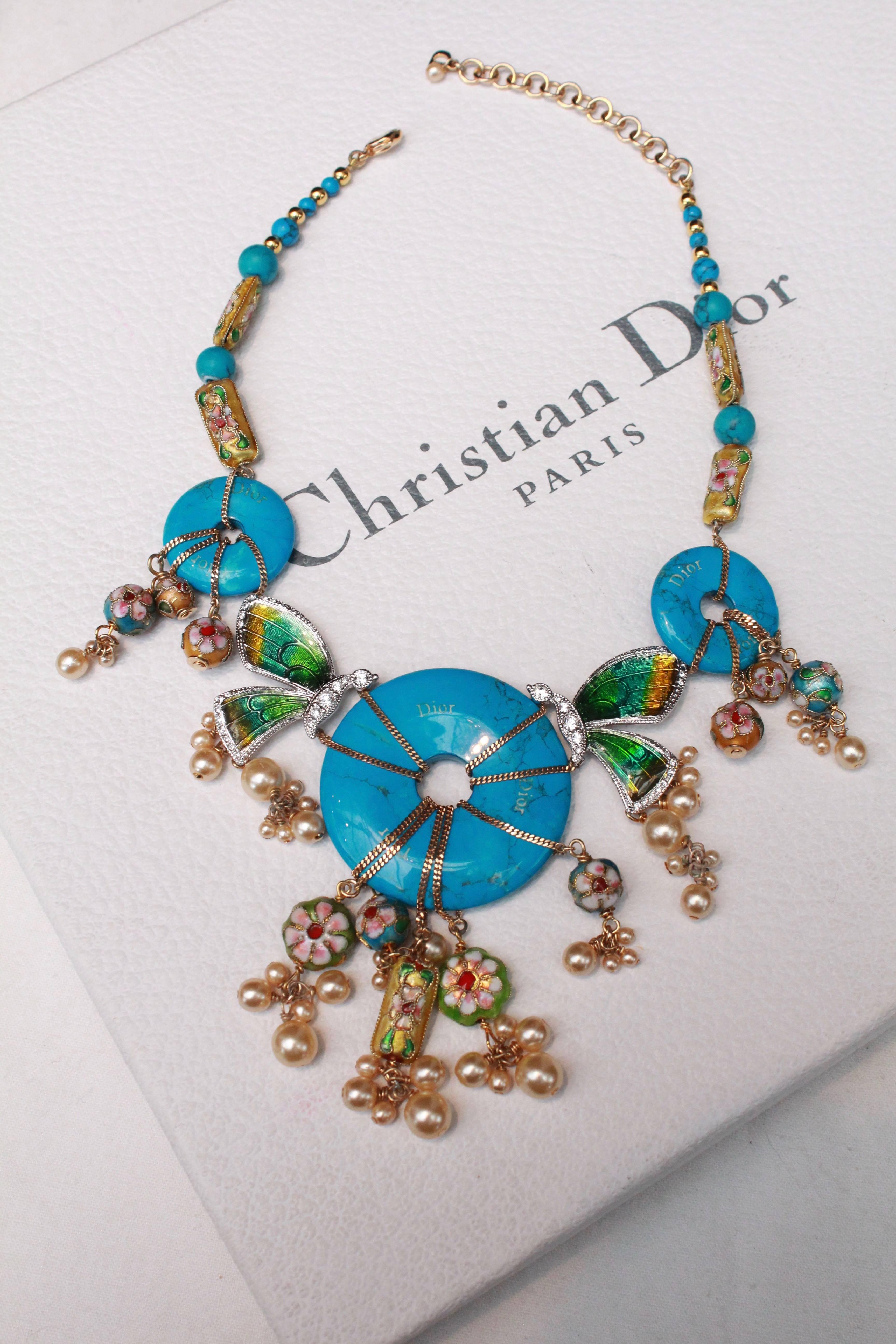 CHRISTIAN DIOR par John Galliano (Made in France) Choker comprised of elongated enameled beads representing flowers, turquoise enameled beads and discs, small golden beads set in gilded metal. In the center, turquoise discs and enameled butterflies