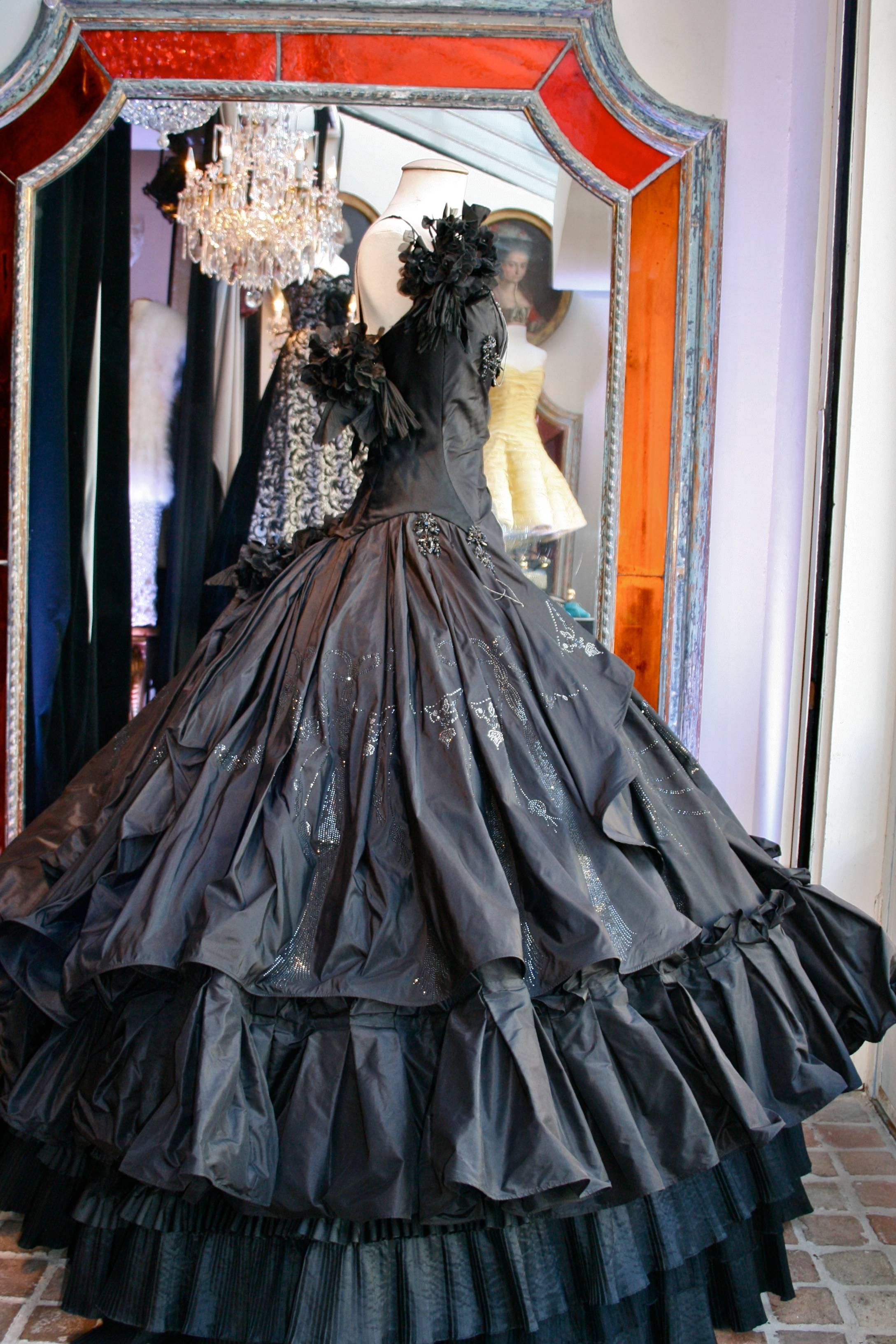 Torrente Défilé Haute Couture by Julien Fournier. Exceptional long dress, black silk taffeta, made of three layers of pleated frills and tulle, with a crinoline -like petticoat.The dress is embellished with black and white rhinestones, and