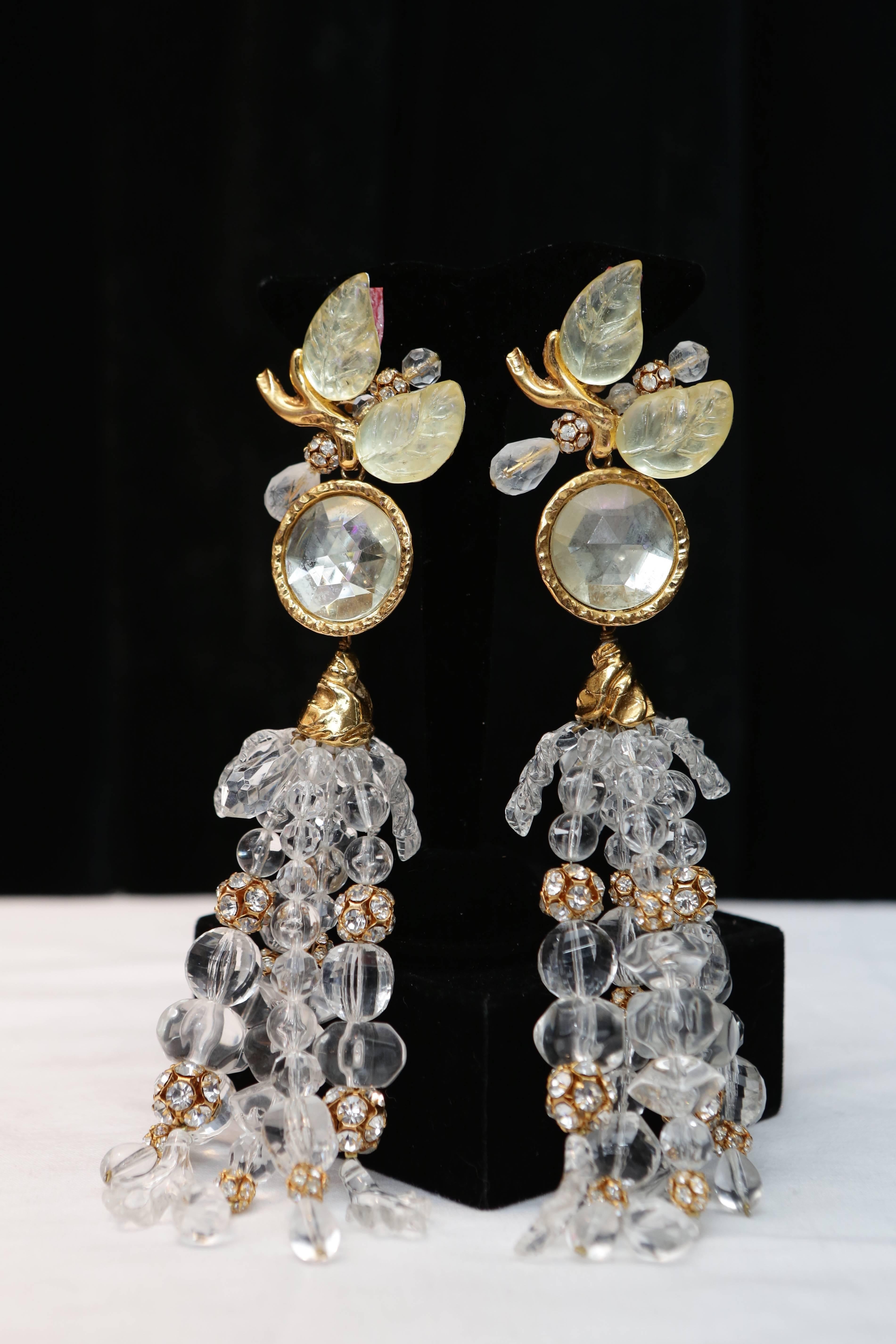 CHRISTIAN LACROIX DEFILE (Made in France) Huge clip-on earrings decorated with a botanical pattern at earlobe, further embellished with a cascade of spheres with rhinestones and transparent faceted glass beads.

Signed at back.

Circa 1980.

Length