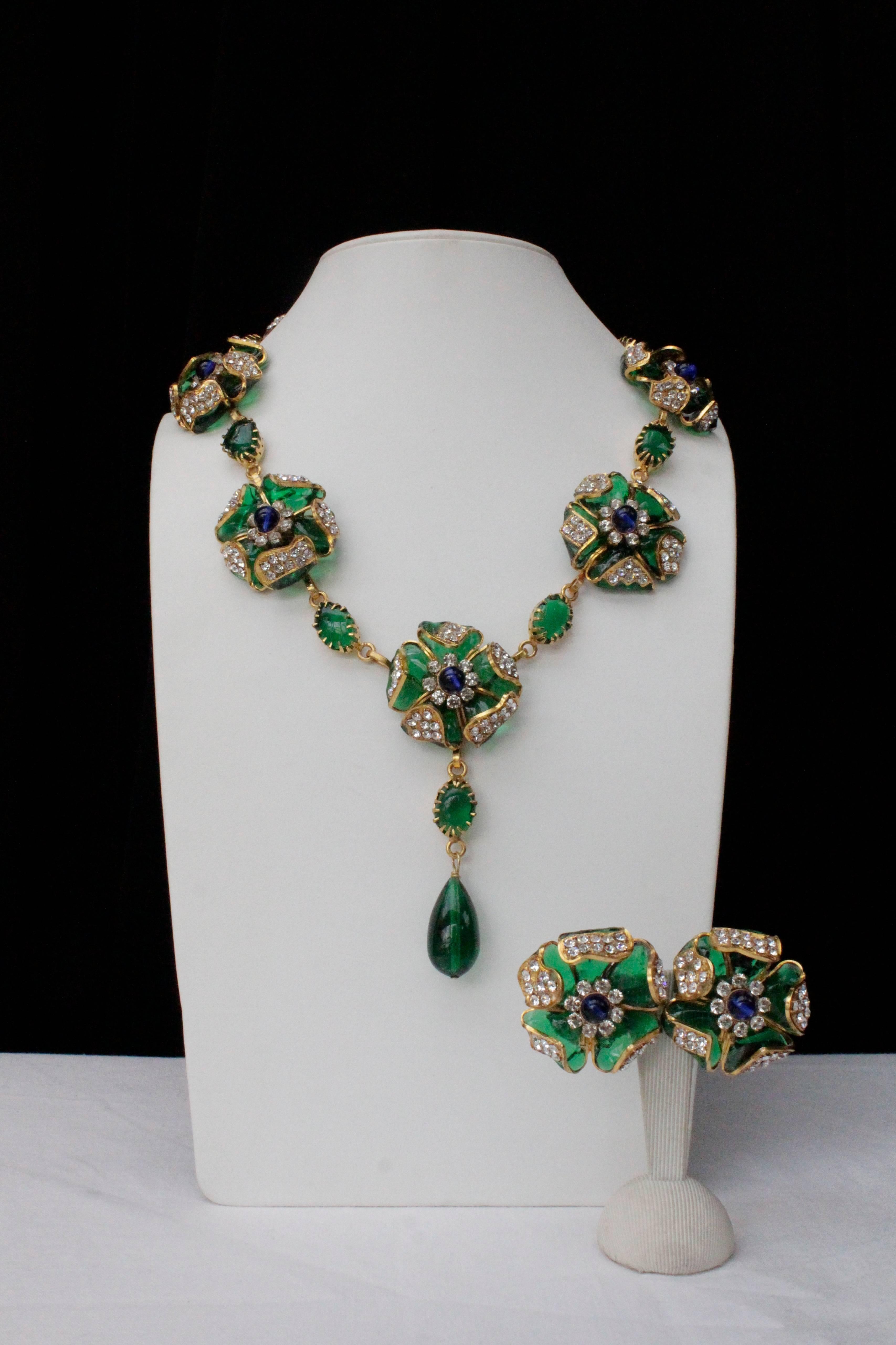 CHANEL (Made in France) Exceptional demi-parure comprised of a necklace and a pair of earrings. The necklace is composed of seven flowers separated by emerald oval glass paste cabochons finished with an emerald  tear-drop pendant. Each flower of the