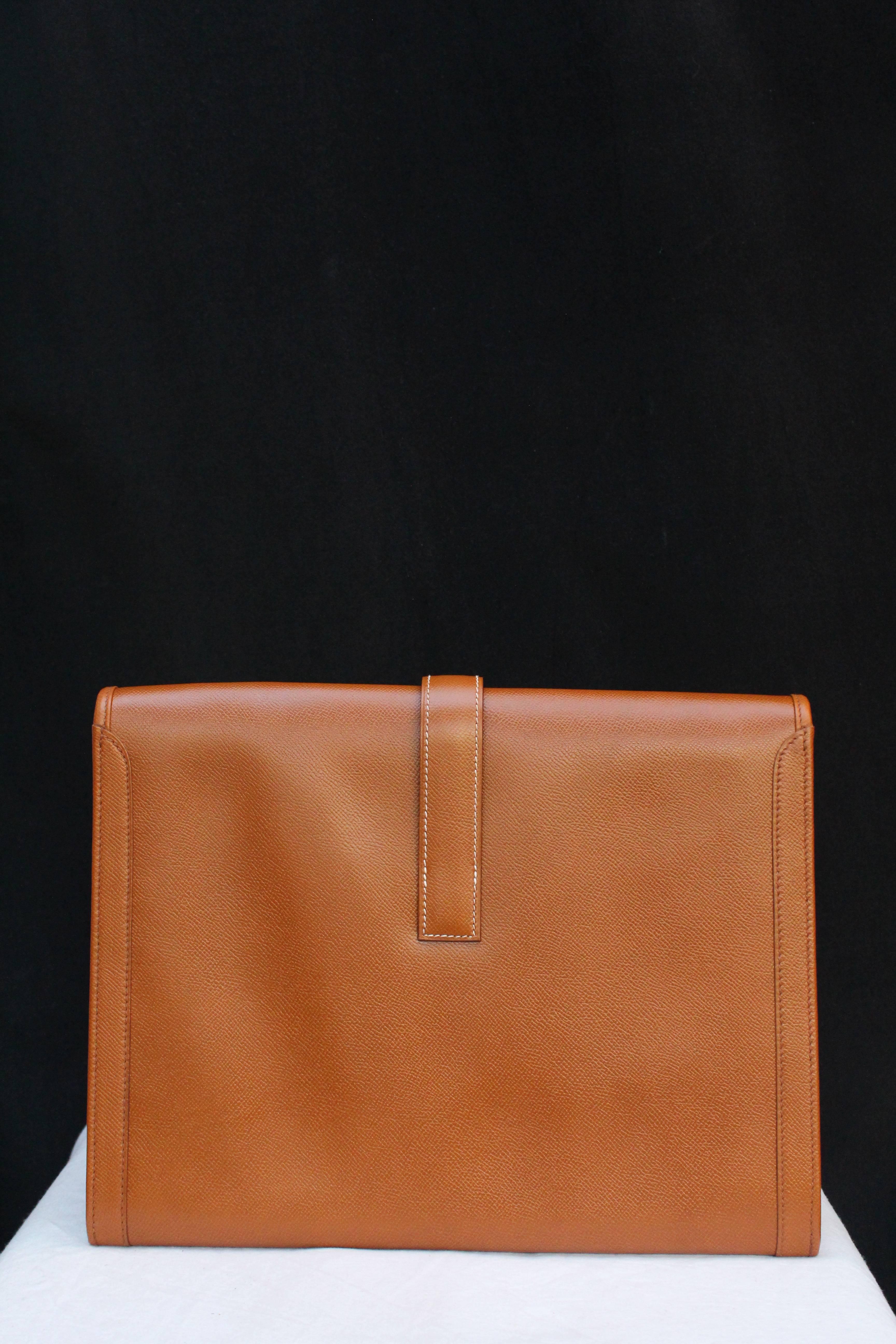 Brown Hermès “Jige” model clutch in tan togo leather