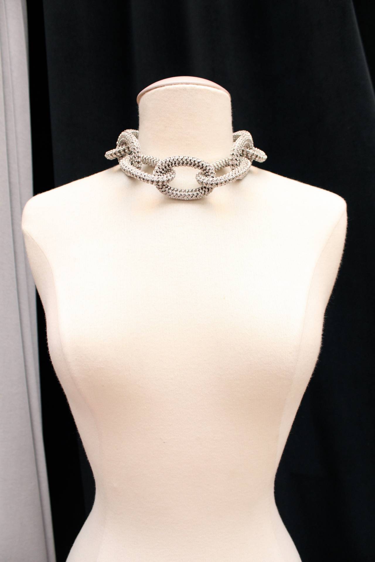 Super chic choker Celine composed of silver metal large chain entirely covered with rhinestones. 
Large clasp in silver metal marked CELINE PARIS, completed with a thin silver metal chain. 

Elegant piece of the 2013 spring collection.