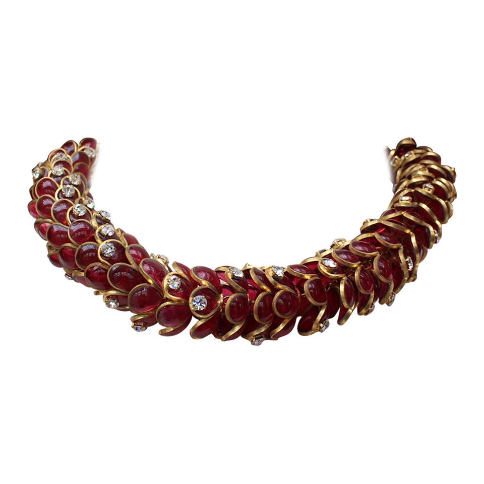 Rare and breathtaking Chanel chocker necklace by Maison Gripoix composed of a succession of elements in the form of flower corollas made in gold metal cercling red glass paste and white Swarovski crystals. The length of the necklace is adjustable