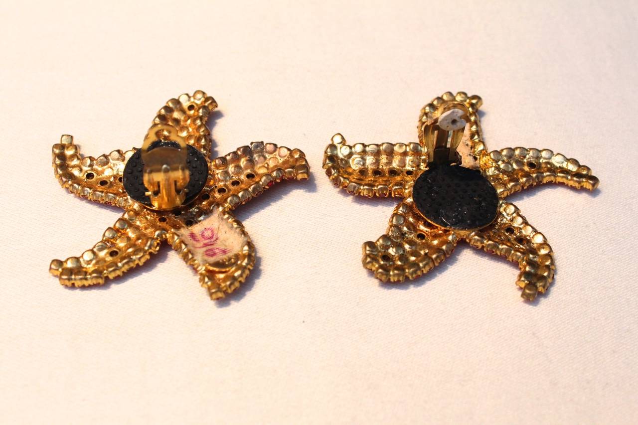 Women's 1980s Yves Saint Laurent Gold Metal and Red Crystals Starfish Earrings