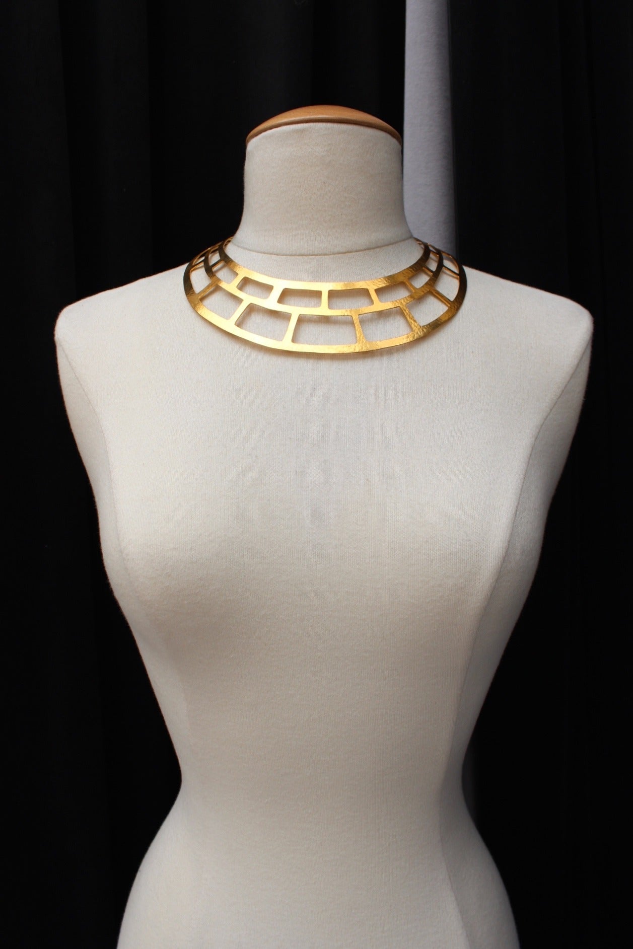 HERVE VAN DER STRAETEN (Made in France) Openwork and hammered gold brass torque necklace constructed with rectangular work. 
Open space in the back. 

Recent Collection. 

Excellent condition. 

Signed (see photo 6)

Dimensions: 
Neck