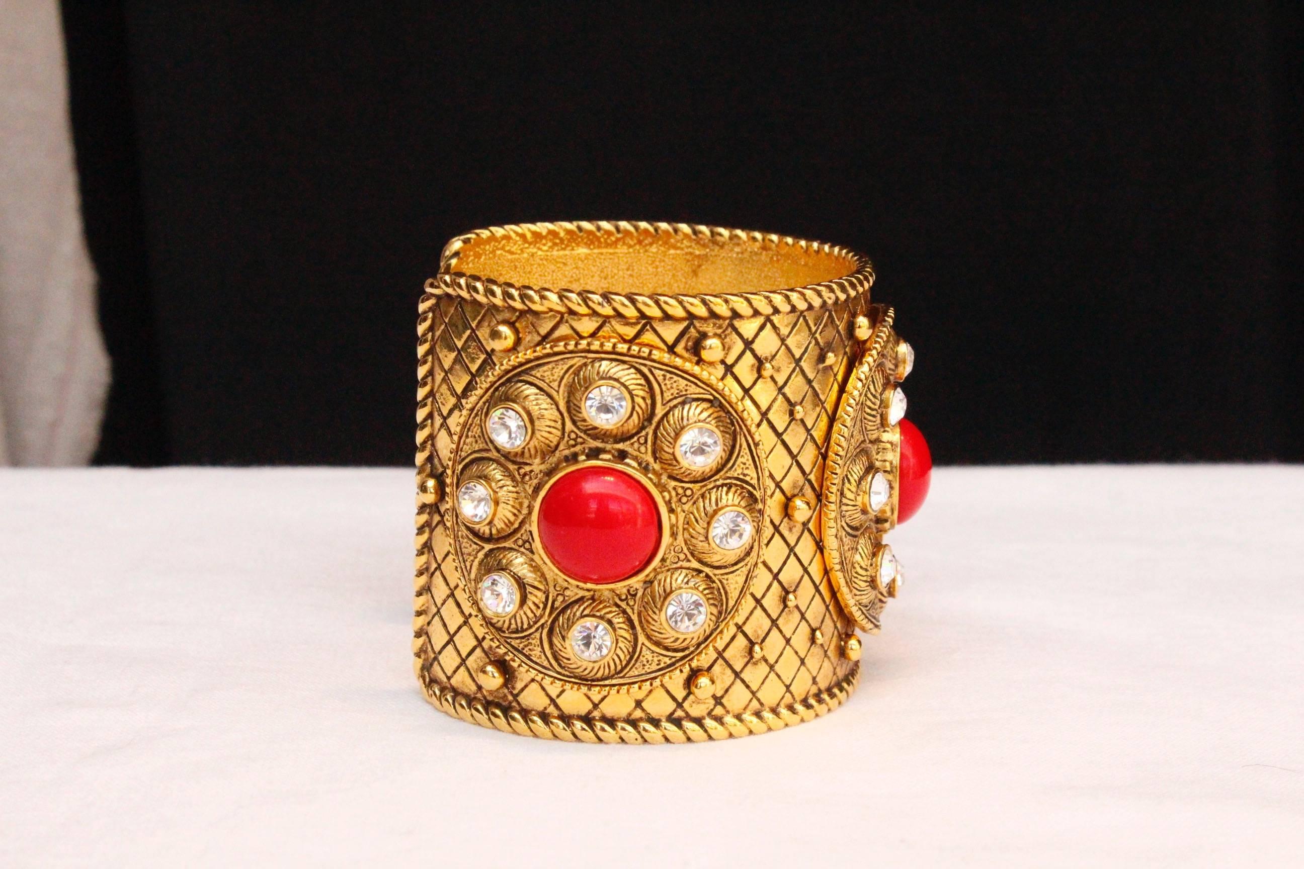 Women's 1990s Christian Dior gilded metal cuff with rhinestones and red cabochons For Sale