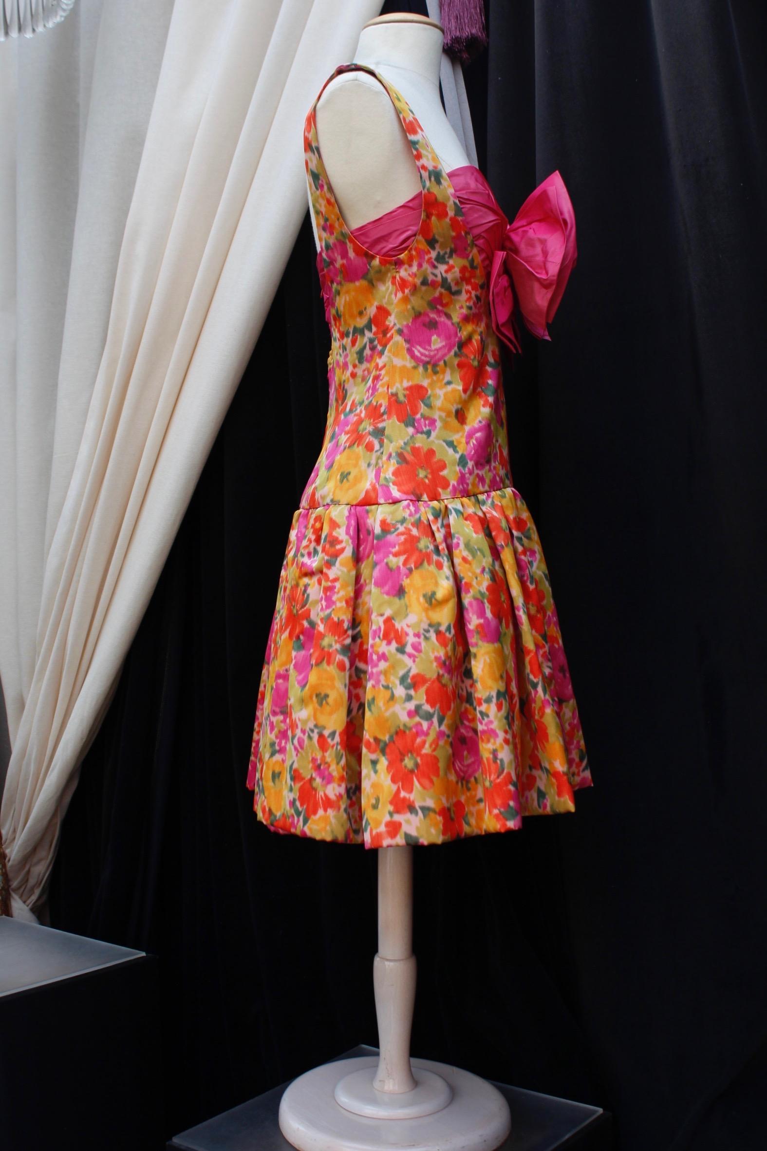 Pink Nina Ricci lovely skater dress with floral pattern, large bow and star For Sale