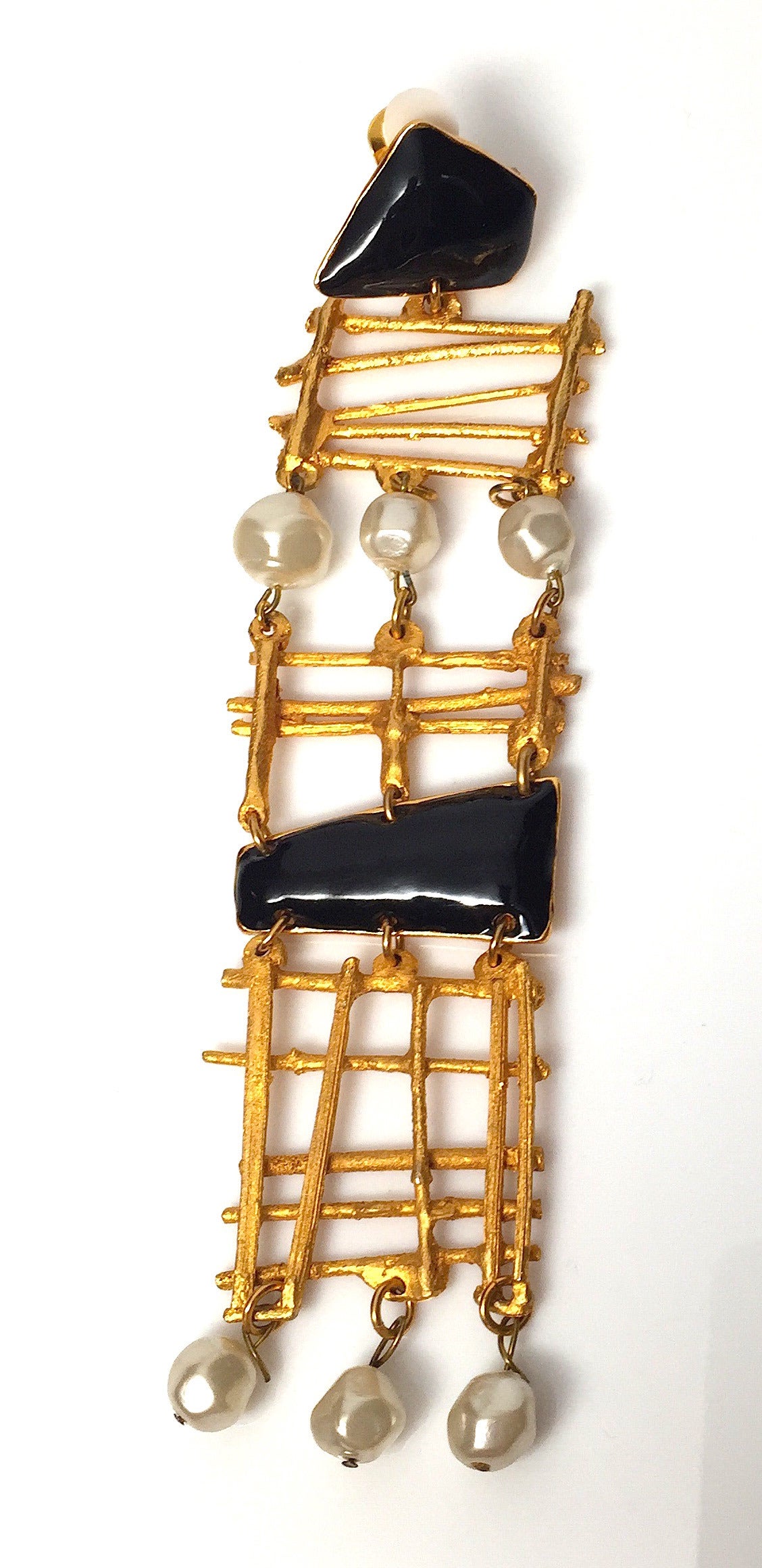Gorgeous Christian Lacroix clip on earrings from the early 1990s featuring architectural gold-tone brass, black enamel, and faux pearl accents. Not to miss! Excellent condition.