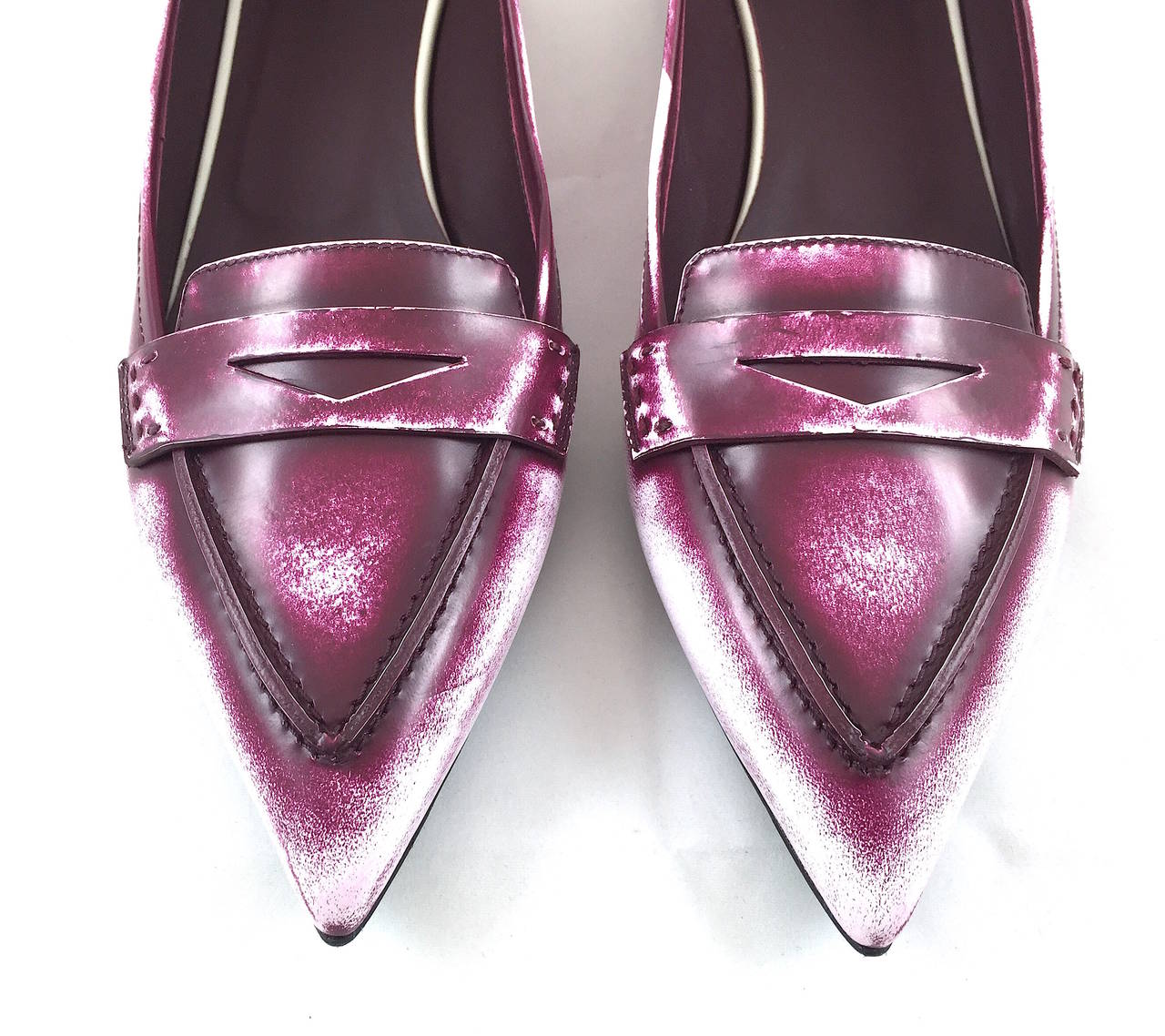 Fendi loafers featuring burgundy and white leather with a faded effect and glossy finish. They have 1