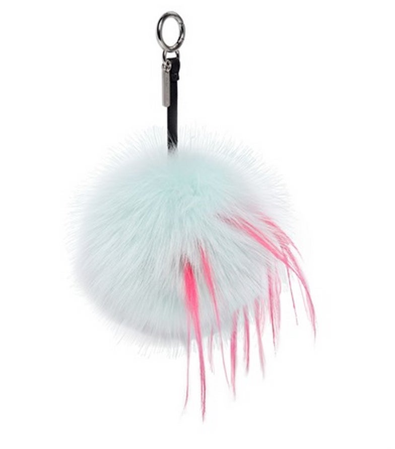 Bag bug monster keychain from Fendi. A soft and playful addition to your keys or handbag, this keychain charm features tufts of mink, goat, fox and rabbit fur surrounding one of Fendi's iconic 