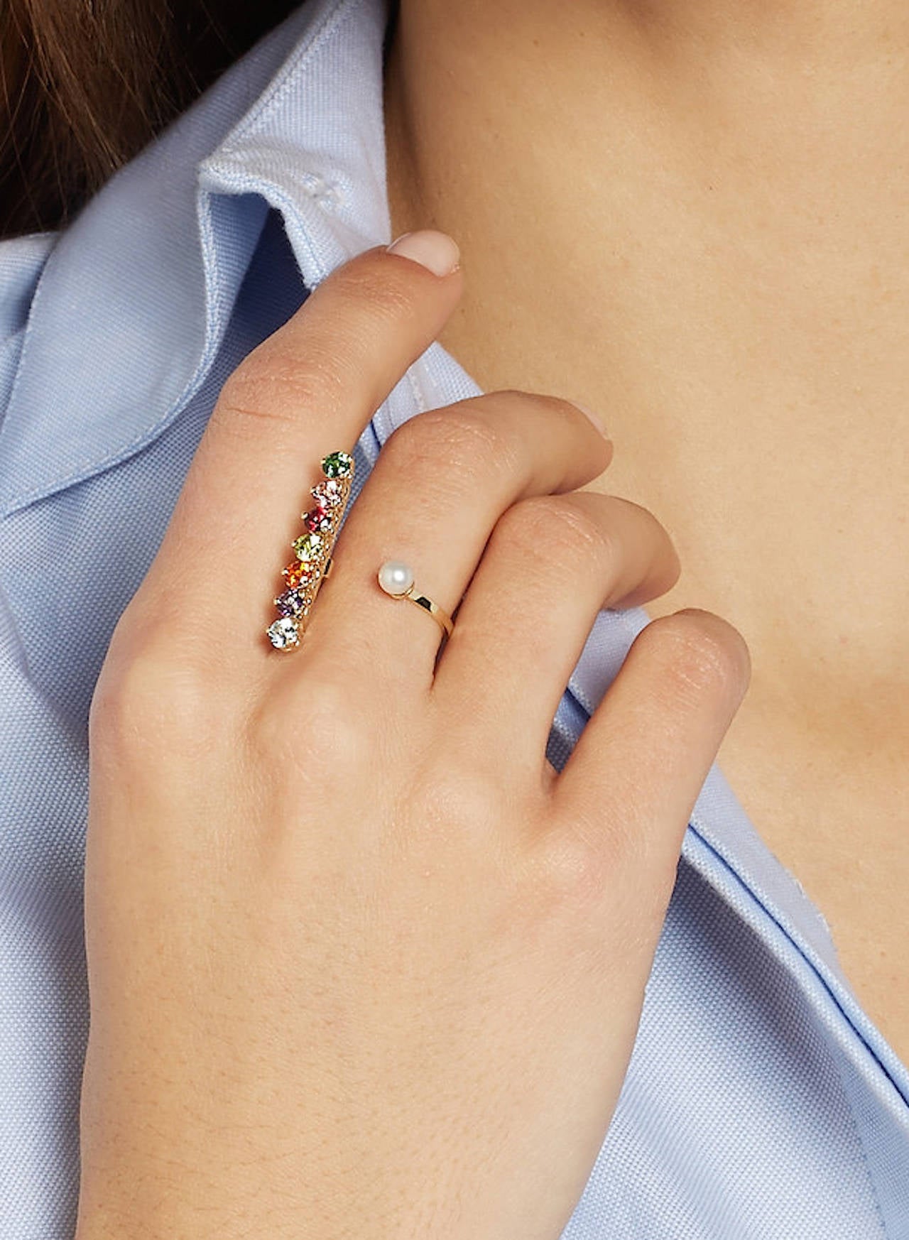 Italian jewelry designer Delfina Delettrez is inspired by Surrealism. This handmade 9-karat gold ring comprises of a pearl stud and a colorful topaz and peridot-embellished bar. Pearl; multicolored topaz stones, total weight: 1.20-carats; peridot,