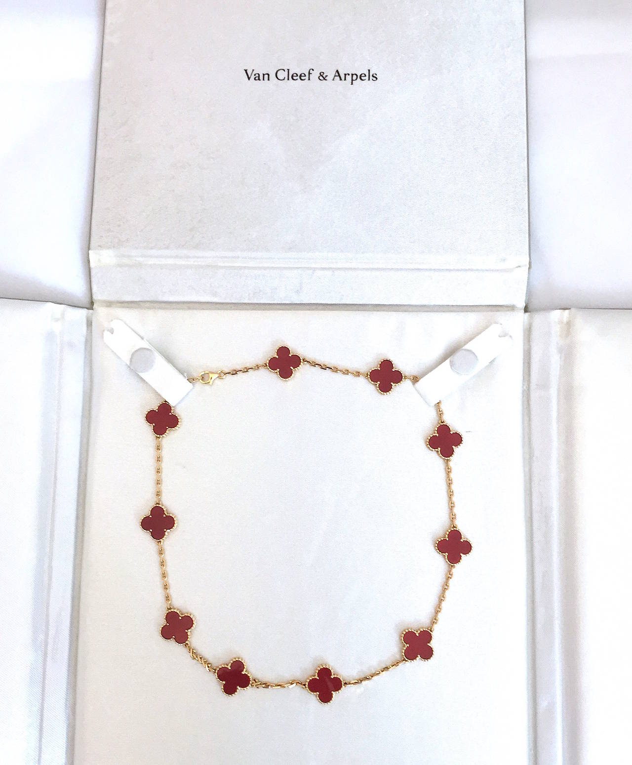 Van Cleef & Arpels Vintage Alhambra necklace with ten carnelian motifs incased in 18K yellow gold with a yellow gold chain and lobster closure.
I purchased this personally from Betteridge in September 2012, the necklace includes the VCA box and