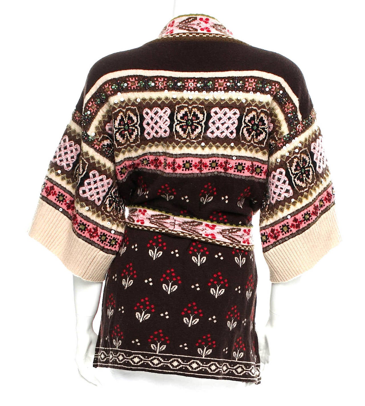 Kenzo vintage brown, tan, and pink multi-colored short sleeved cardigan with belt closure, embroidery, and sequin embellishments with flower motif. 
Measurements: Bust 36”, Waist 38”, Length 29” 
Fabric Content: 76% Wool, 20% Polyamide, 4%