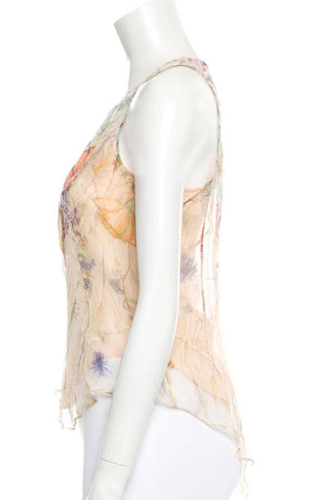 Alexander McQueen semi-sheer pink floral print sleeveless blouse with sheer underlay. The blouse features button details at bust, a peach camisole to wear under the blouse, and exterior stitching accents.

Measurements: bust 34