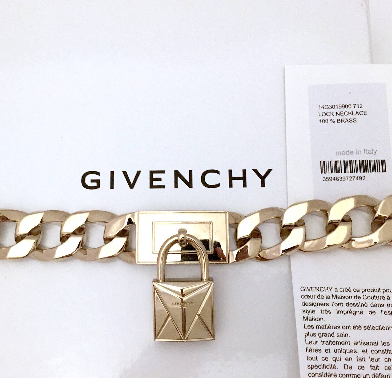 Givenchy pale gold-tone plated brass curb chain choker with padlock pendant and push-lock closure. Includes original box and dust bag.

Measurements: 
Necklace 15.5
