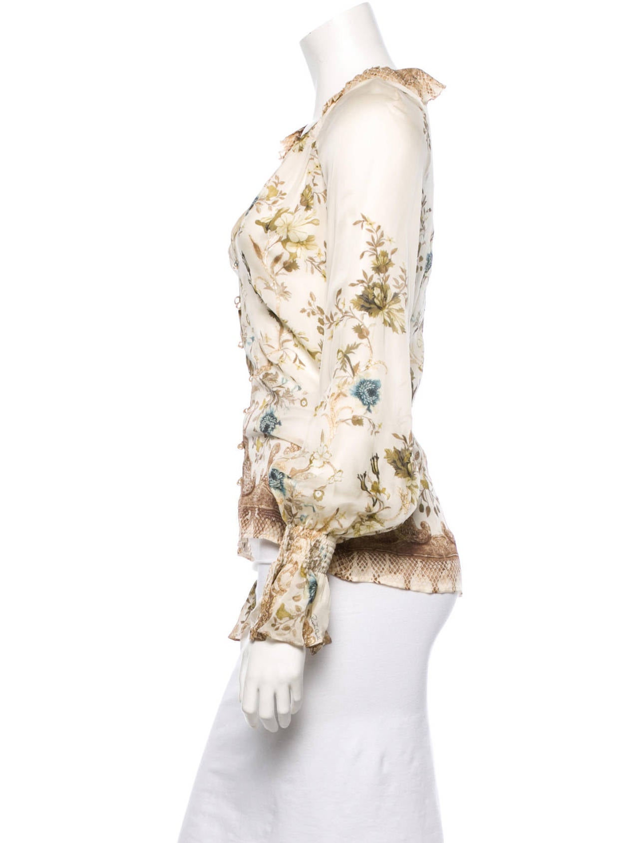 Roberto Cavalli ivory silk long sleeve blouse with pleated collar, multicolor floral and snakeskin print with gold-tone threads throughout, and faux pearl front button closure.

Measurements: Bust 32”, Waist 26”, Length 24.5”