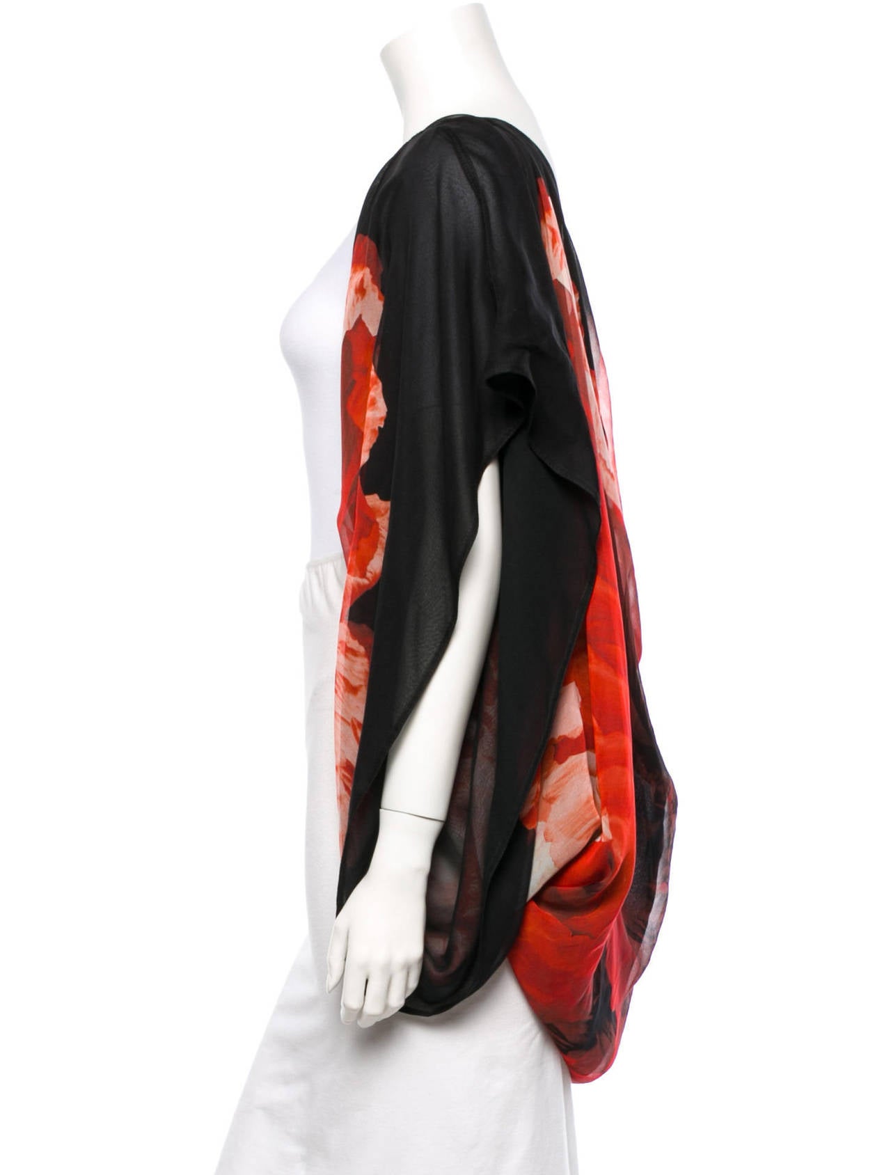 Stunning Alexander McQueen silk shawl with abstracted red, black, and white poppy print. Measurements: Bust 65”, Waist 65”, Length 31”