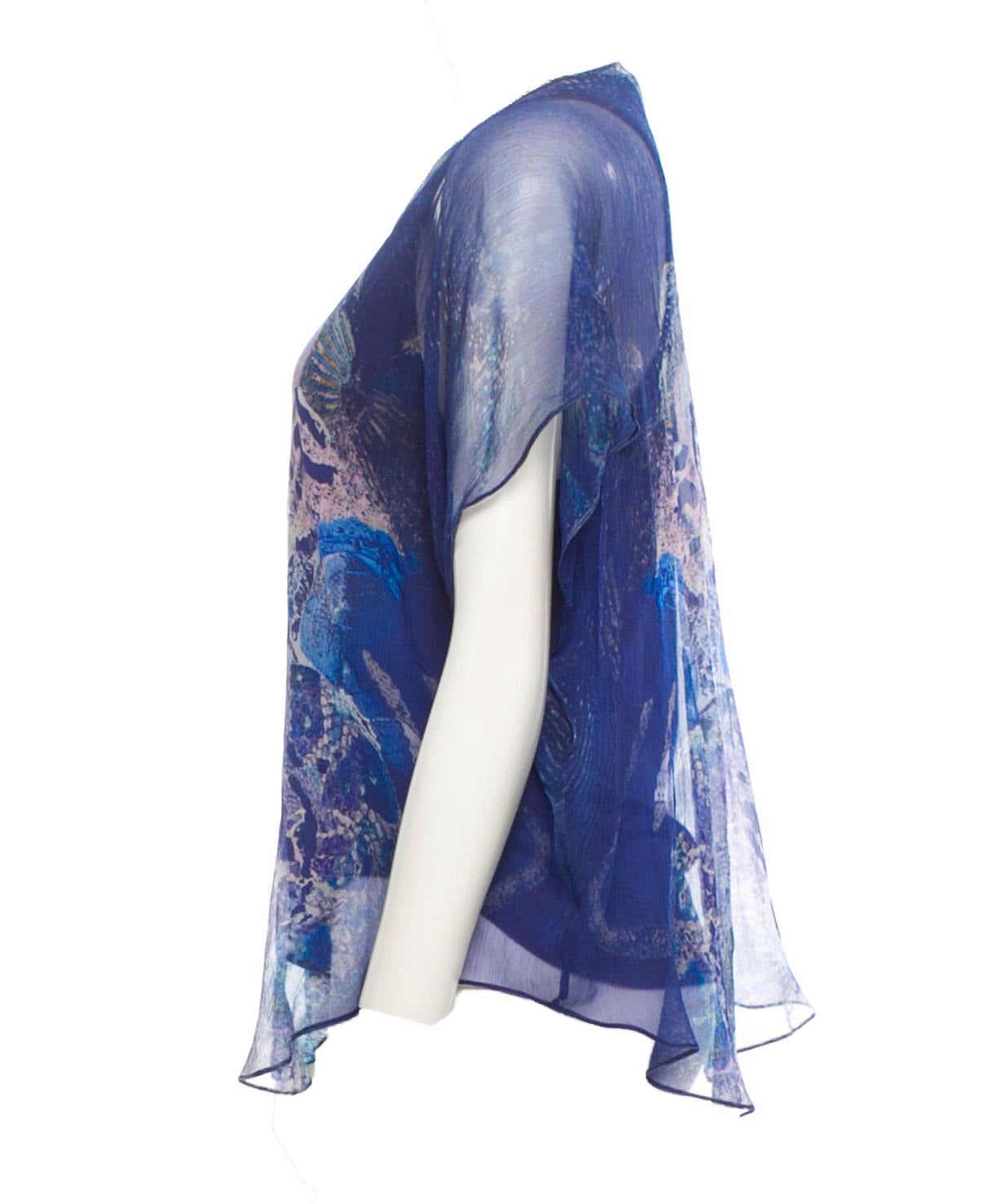 Rare collector's item Alexander McQueen multi-color sheer silk blouse from his famous Spring/Summer 2010 Plato's Atlantis Collection with scoop neck, bat wing sleeves, and white, light blue, pink and black reptile print at front.

Bust 34”, Waist
