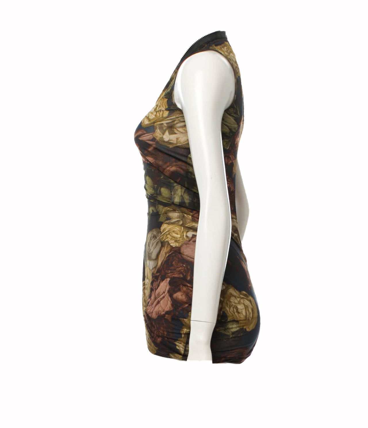 Alexander McQueen floral silk sleeveless blouse from his Spring Summer 2010 Plato's Atlantis Collection. The  blouse features a front zippered closure.

Bust 28”, Waist 22”, Length 30”

100% Cupro
