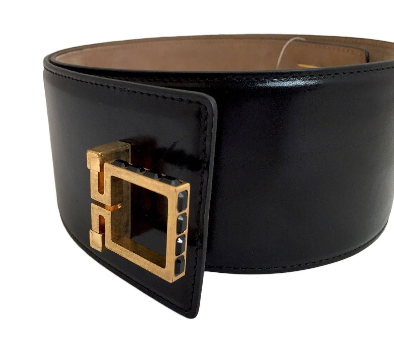 Black Alexander McQueen wide leather belt with gold-tone hardware, crystal embellishment and flip lock closure. Includes tags.

Measurements: Length 35“, Width 3”