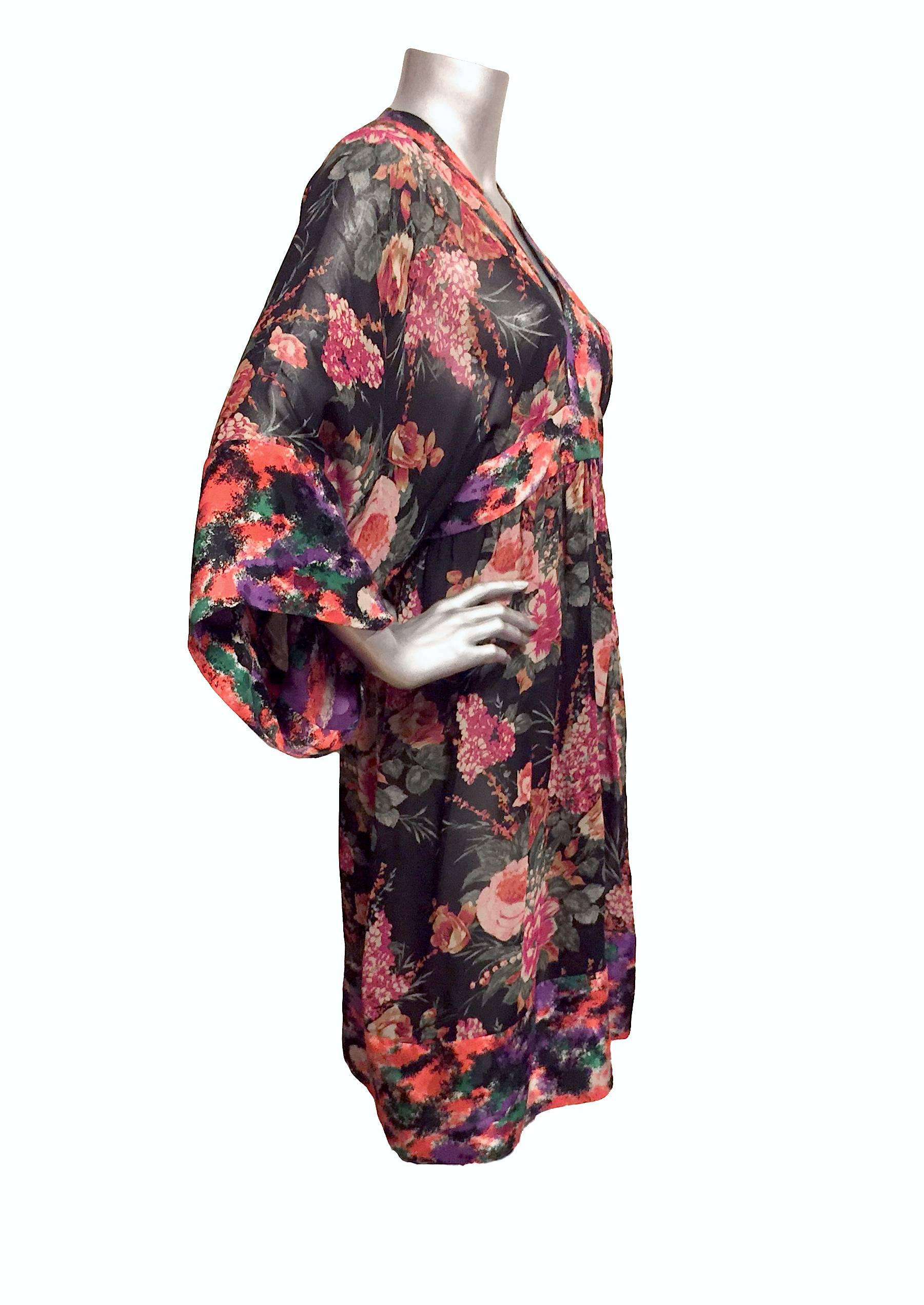 Bright Duro Olowu dress with floral print, wide sleeves, and back zipper closure.

Measurements: Bust 34
