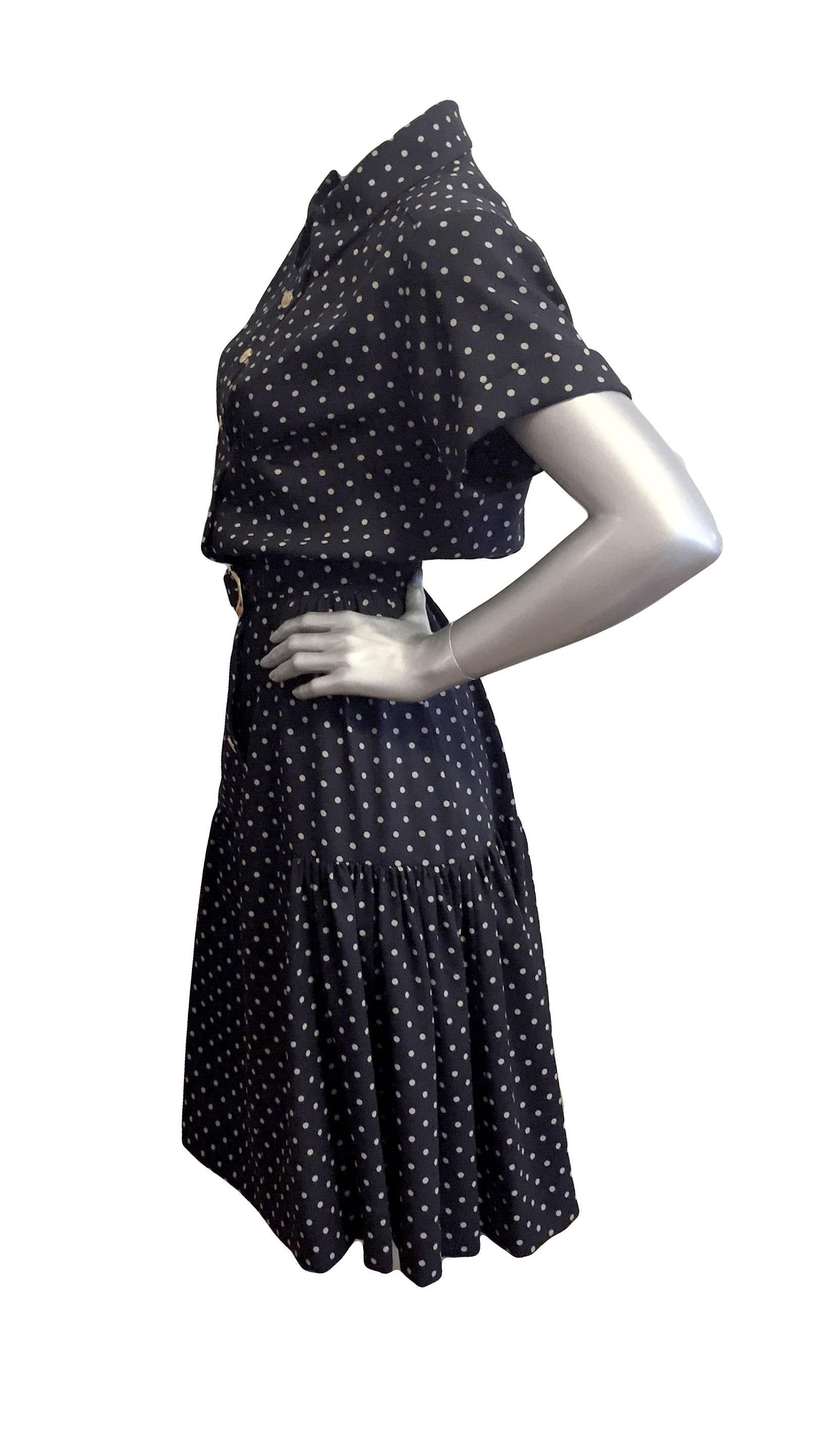 Glam Chanel black dress with ivory dots, gold-tone buttons at front, and accompanying belt, flounce hem, and lightly padded shoulders. Difficult to read the fabric tag, but feels like crepe.

Estimated size US 4

Measurements: Length 46