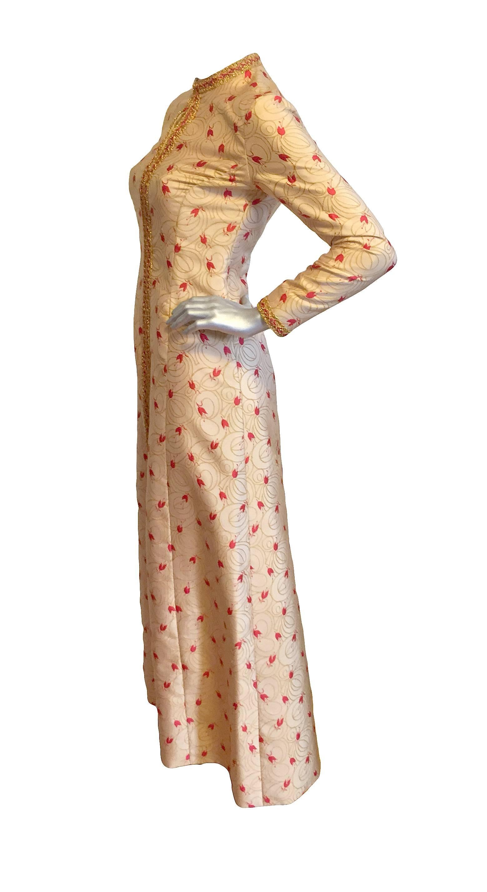 Regal Adele Simpson yellow and red brocade gown with metallic trim, key hole at neck, and front zipper closure. 

Measurements: Length 54