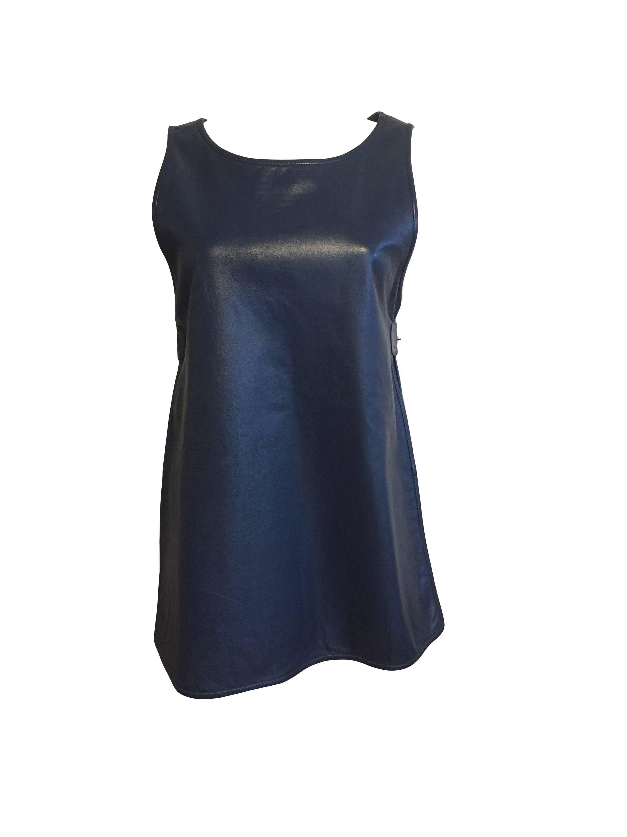Rare iconic Bonnie Cashin Sills mod navy leather dress or tunic with adjustable turnlock side closures. Made from angola leather and lined in cotton blend, it fastens on each side with Cashin's (and Coach's) trademark brass toggles. 

Measurements
