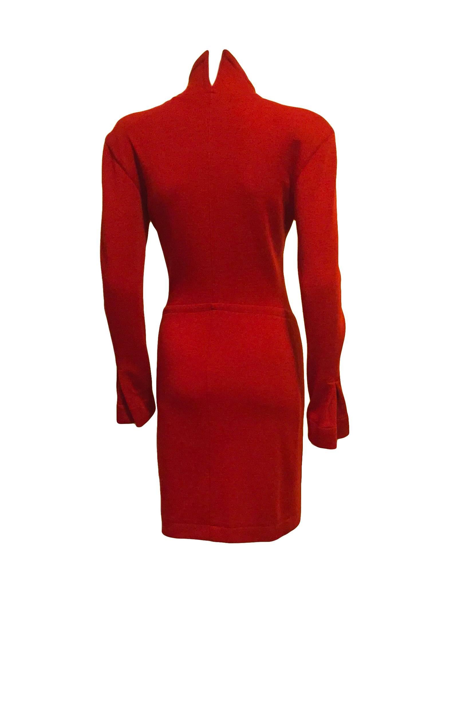Deep red Claude Montana wool bodycon dress with front zipper at neckline and pocket at front, bell sleeves, slim shoulder pads, architectural collar, and terrific seams throughout emphasizing the shape of the dress.