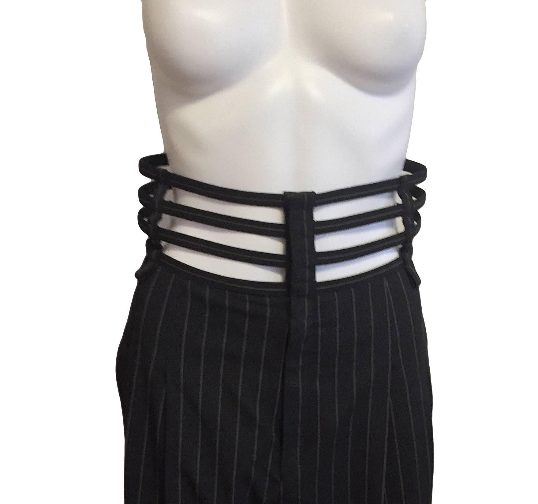 Iconic Jean Paul Gaultier Femme black wool with ivory pinstripes pants with a boned cage at waist.