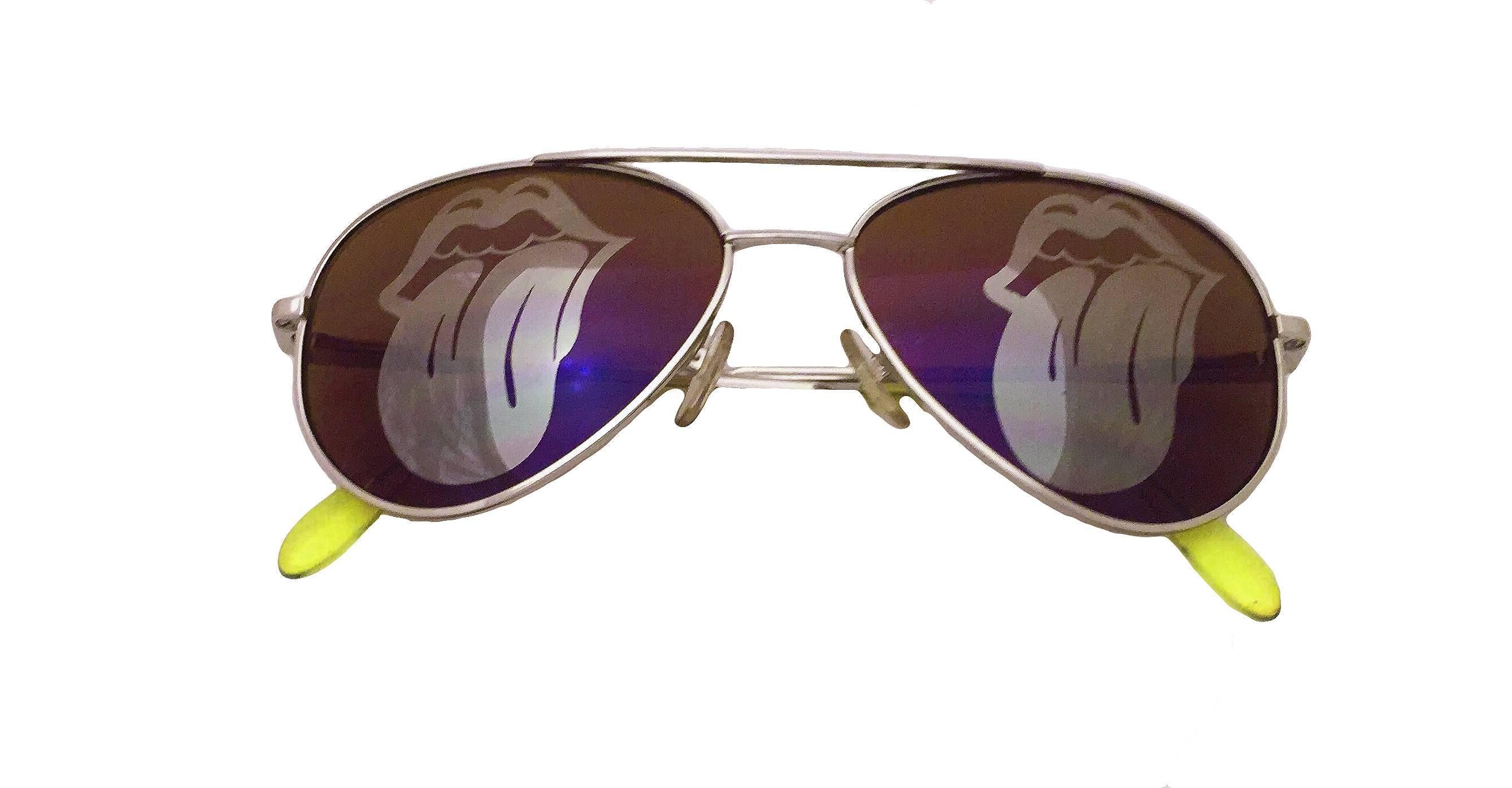 Exceptionally rare promotional Comme des Garcons Homme Plus X Cutler and Gross sunglasses from the 2006 Spring/Summer Collection. They feature aviator style frames and blue lenses with the Rolling Stones lip and tongue logo printed on them. They