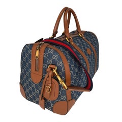 Gucci Denim GG Supreme Canvas and Brown Leather Duffle Bag, Spring/Summer 2022.
