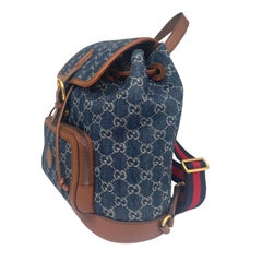 Gucci Denim GG Supreme Canvas and Brown Leather Backpack, Spring/Summer 2022.
