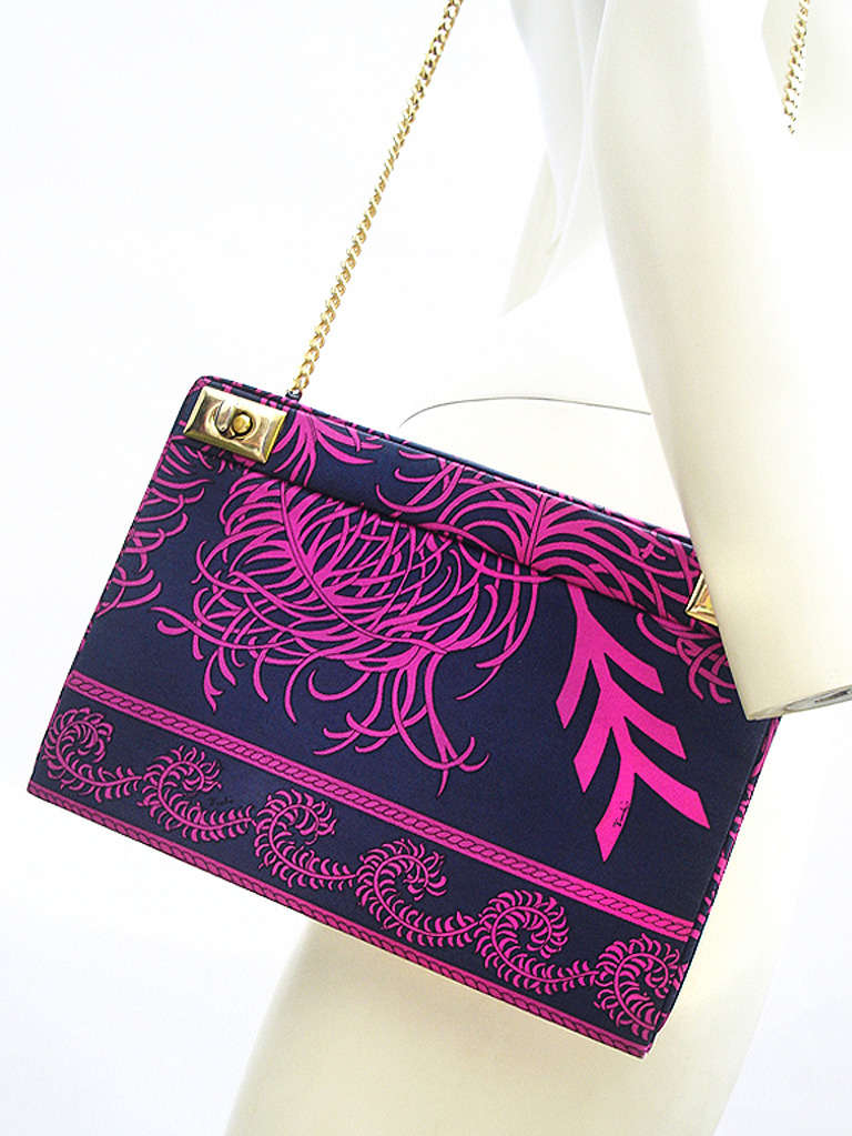 We have seen our share of of Vintage 1960's Pucci Bags and this Stunning one  Sooo IS the Best!   Nothing Beats how Bohemian Chic this feels hanging from ones shoulder -

LOVE  the  Beautiful Mod Feather  Pucci Print in Darkest Navy and Electric