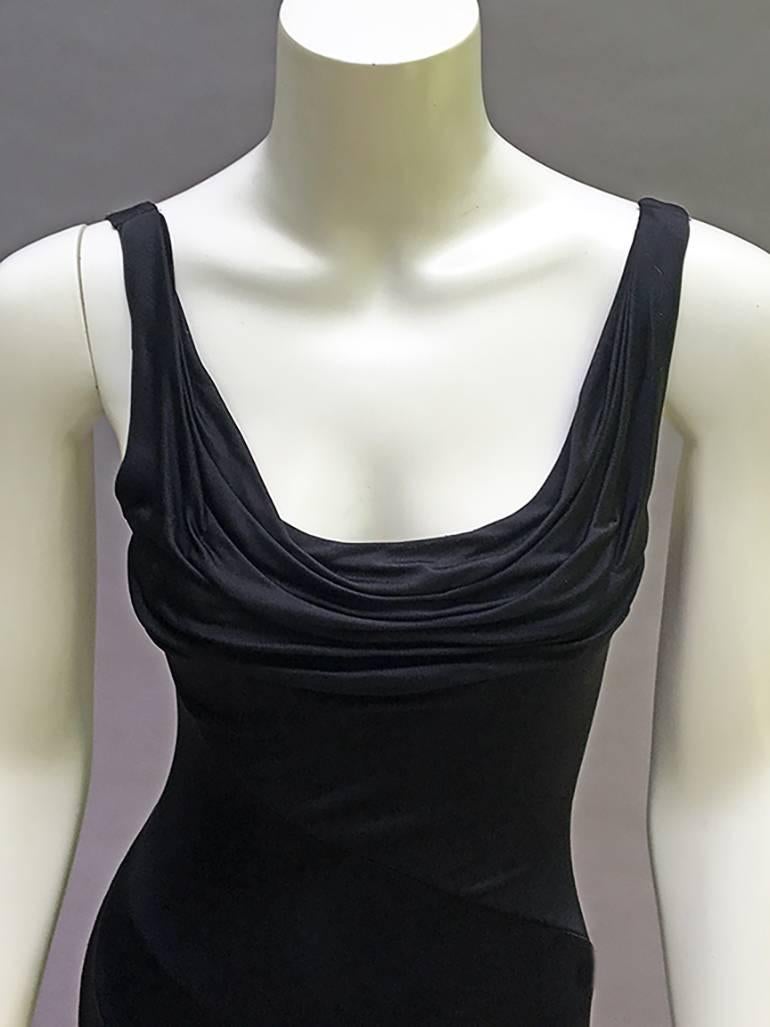 Vintage Gianni Versace 90's  Ruched sexy dress with asymmetrical seams- 

This is super soft  stretchy and so clingy-  Ruching is tacked down - 

Best Black jersey knit  - fabric is 2 plied - same fabric in as in out -( instead of being lined