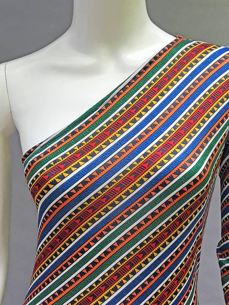 best 70s dress ever- print is fantastic- and super flattering - 
 all the colors are there red ,blue, green, orange, yellow and black ...
we love a dress that can go from day to night and this 70s Jersey Maxi Dress fits the bill