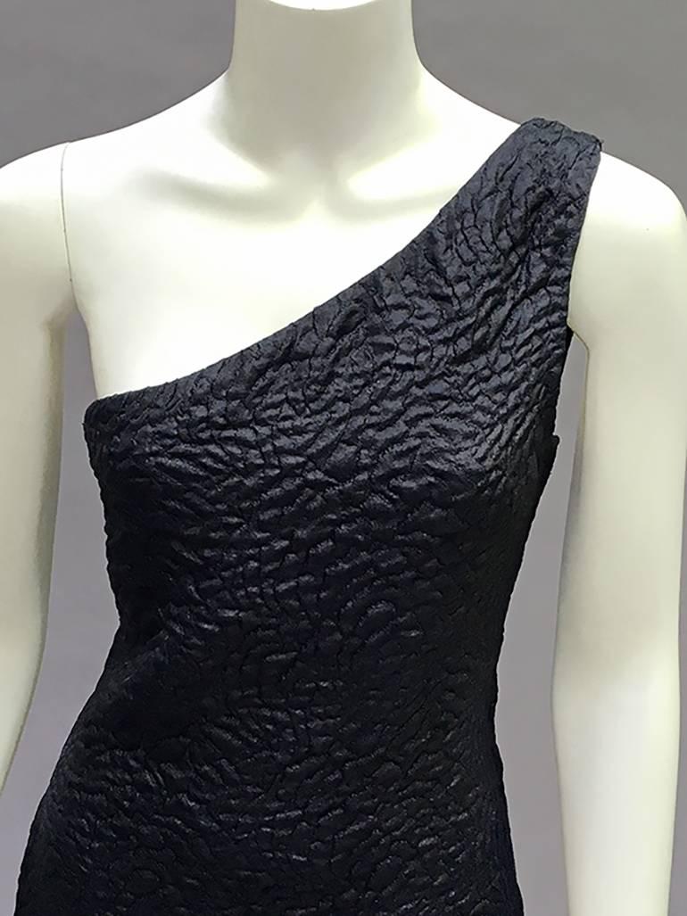 so so beautiful 80s or 90s YSL Rive Gauche Dress!!!
it might not look like not so much when its off - but holy moly- due to an exquisite magic cut- this becomes sublime when on The  fantastic fabric although a textured brocade is 
light as a