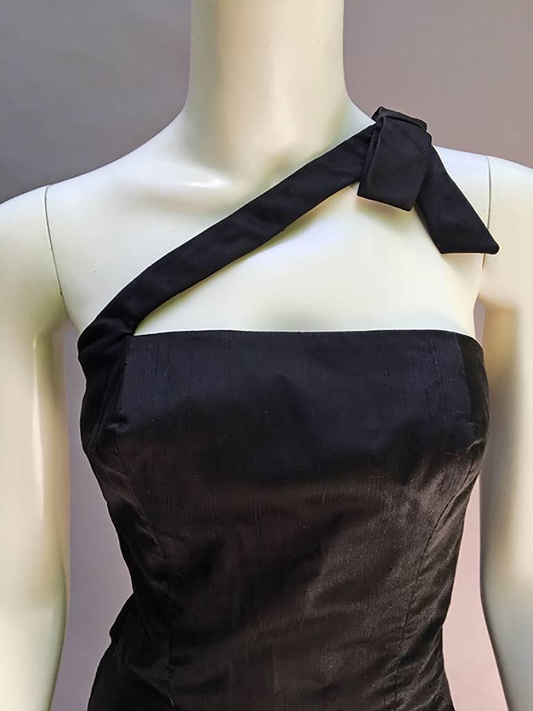 

Classic Estevez - so elegant so sexy- and that bow !!!
which lends this classic dress a bit of the tuxedo  look.

Black Raw Silk Is Soft Yet Structured. Crispy, Clean, And Totally Mint.

Exquisite Seams Defining The Shape Of The Bust, Waist