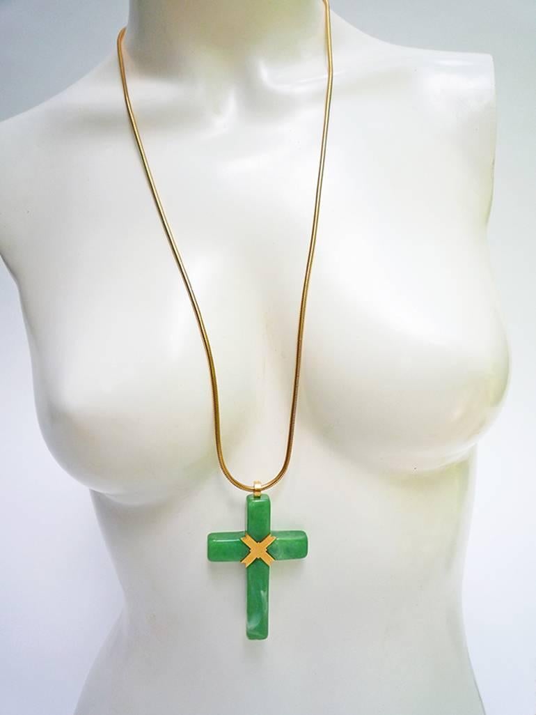 Gorgeous Givenchy necklace with super long gold tone snake chain and an oversized spectacular resin cross pendant in a jade green color- absolutely fantastic !
 Pendant sits between and below the bust. A early piece from this type of Givenchy -