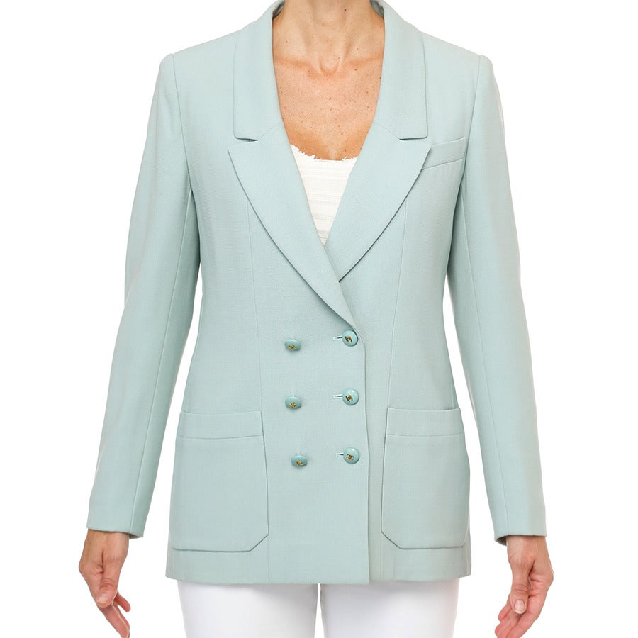 The twist in the weave of wool crepe makes it one of the best & most comfortable fabrications for a more fitted jacket silhouette. Normally available from CHANEL in black or navy,  this interpretation in a fashion pastel aqua color is rare. Easy to