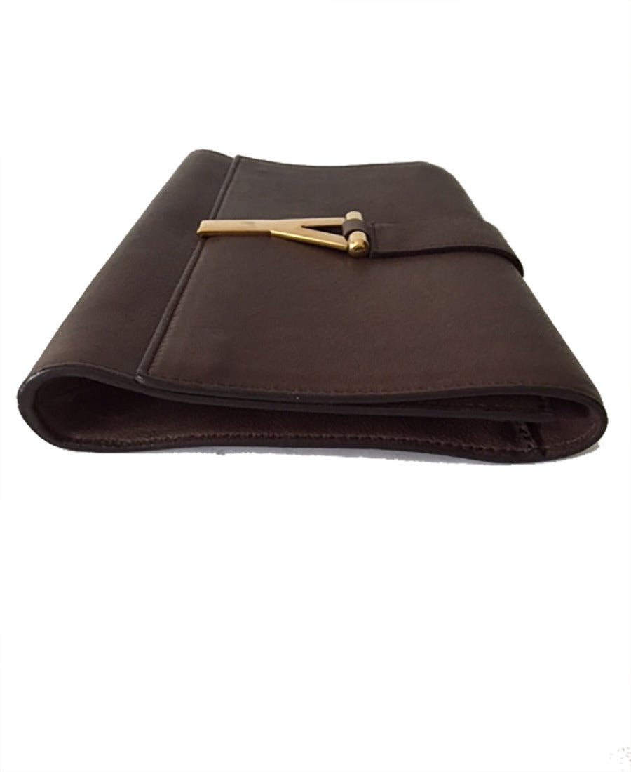 YSL, Yves Saint Laurent brown leather gold ligne Y clutch. A chic clutch in soft leather is simply adorned with a brushed gold-toned 