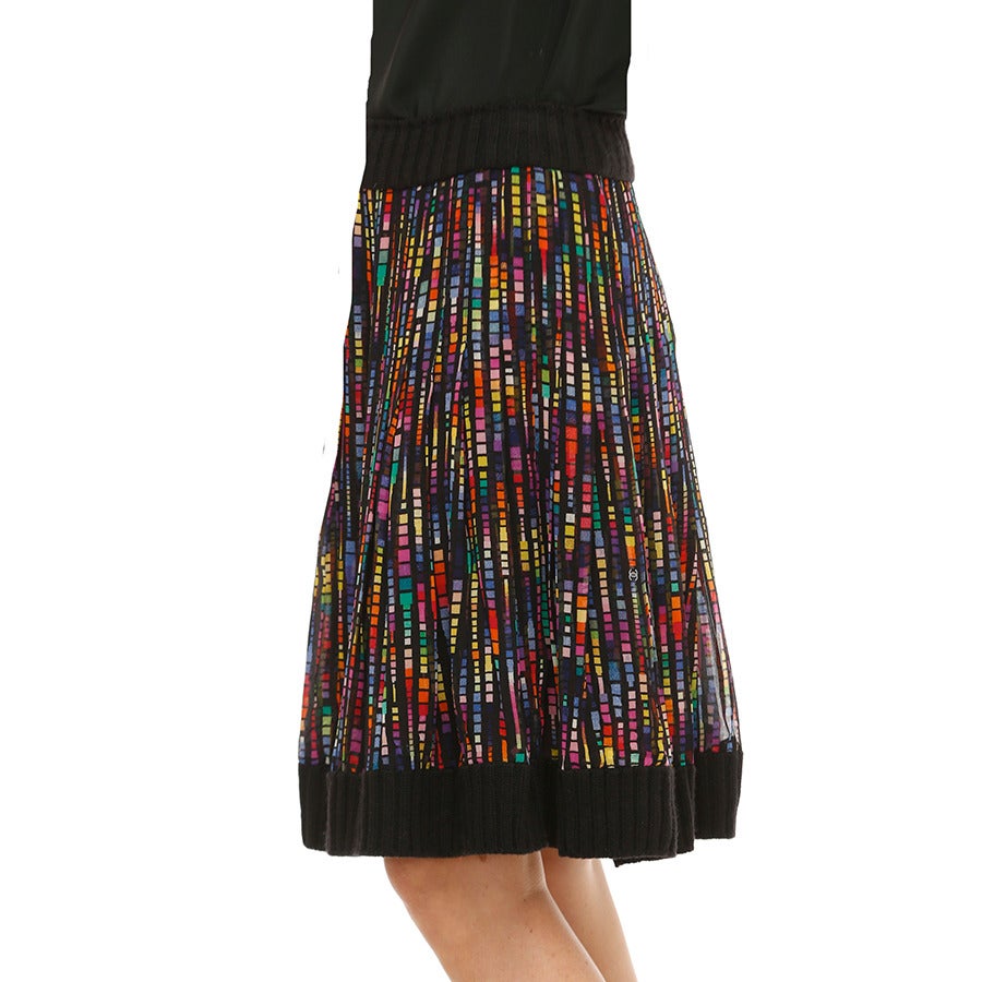CHANEL is always experimenting with combinations of different textures and this colorful skirt offers a unique mix of ultra light - almost transparent silk chiffon  with soft ribbed knit cashmere at waist & hem. The silhouette features subtle mini