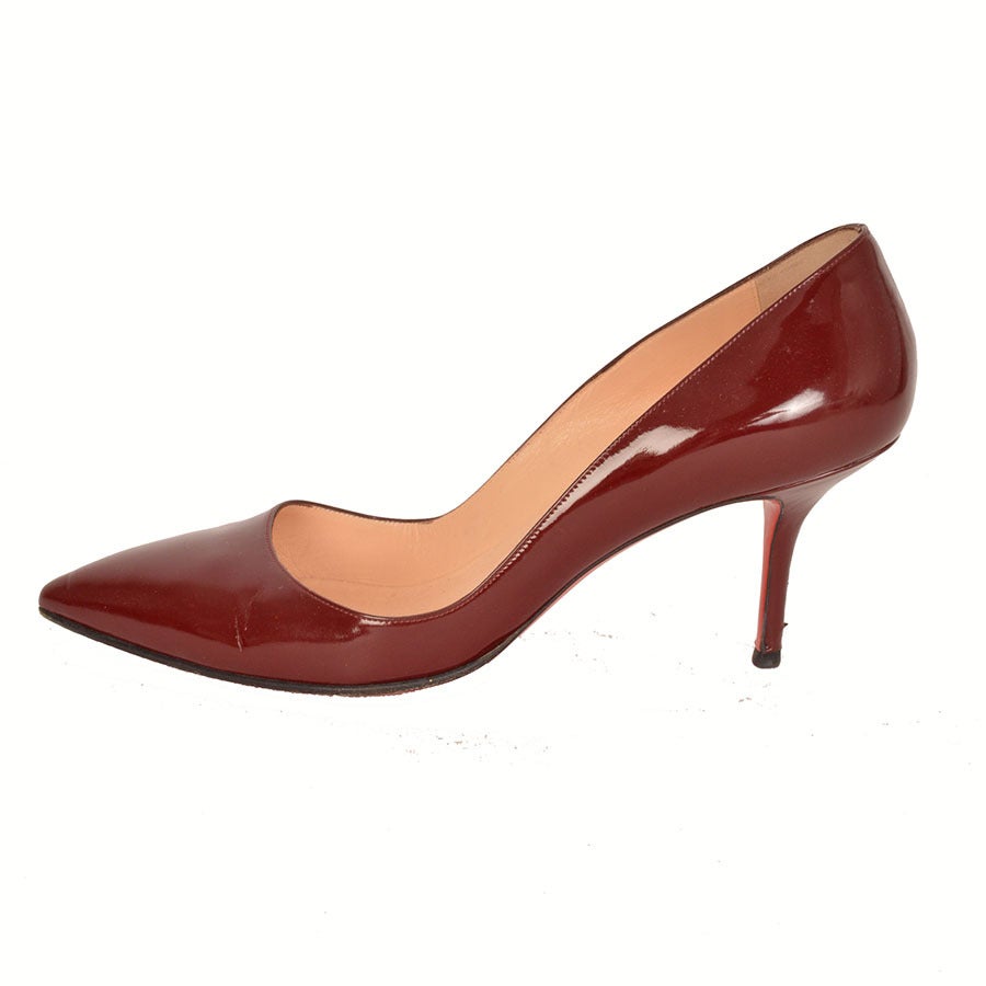 Christian Louboutin burgundy patent leather pointed toe pumps.
- Pointed toe, single sole
- Measurements: Heel height: 3